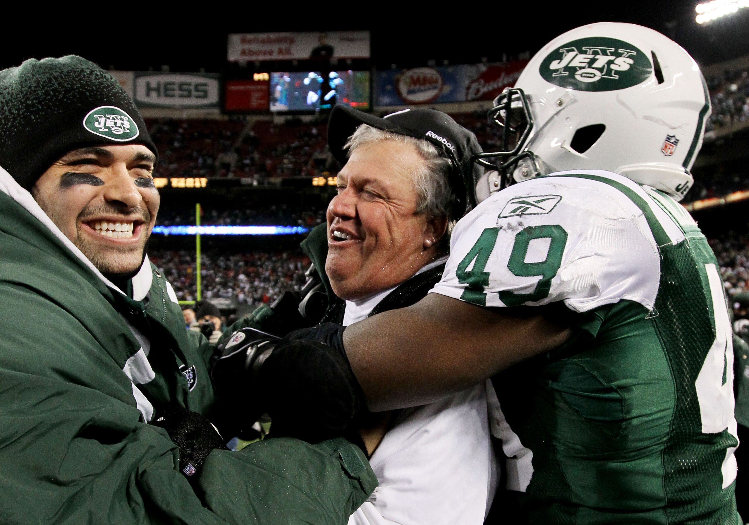 EAST RUTHERFORD, NJ - JANUARY 03:  Quarterback  Mark Sanchez #6, head coach Rex Ryan and Tony Richardson #49 of the New York Jets celebrate their 37-0 victory over the Cincinnati Bengals at Giants Stadium on January 3, 2010 in East Rutherford, New Jersey.