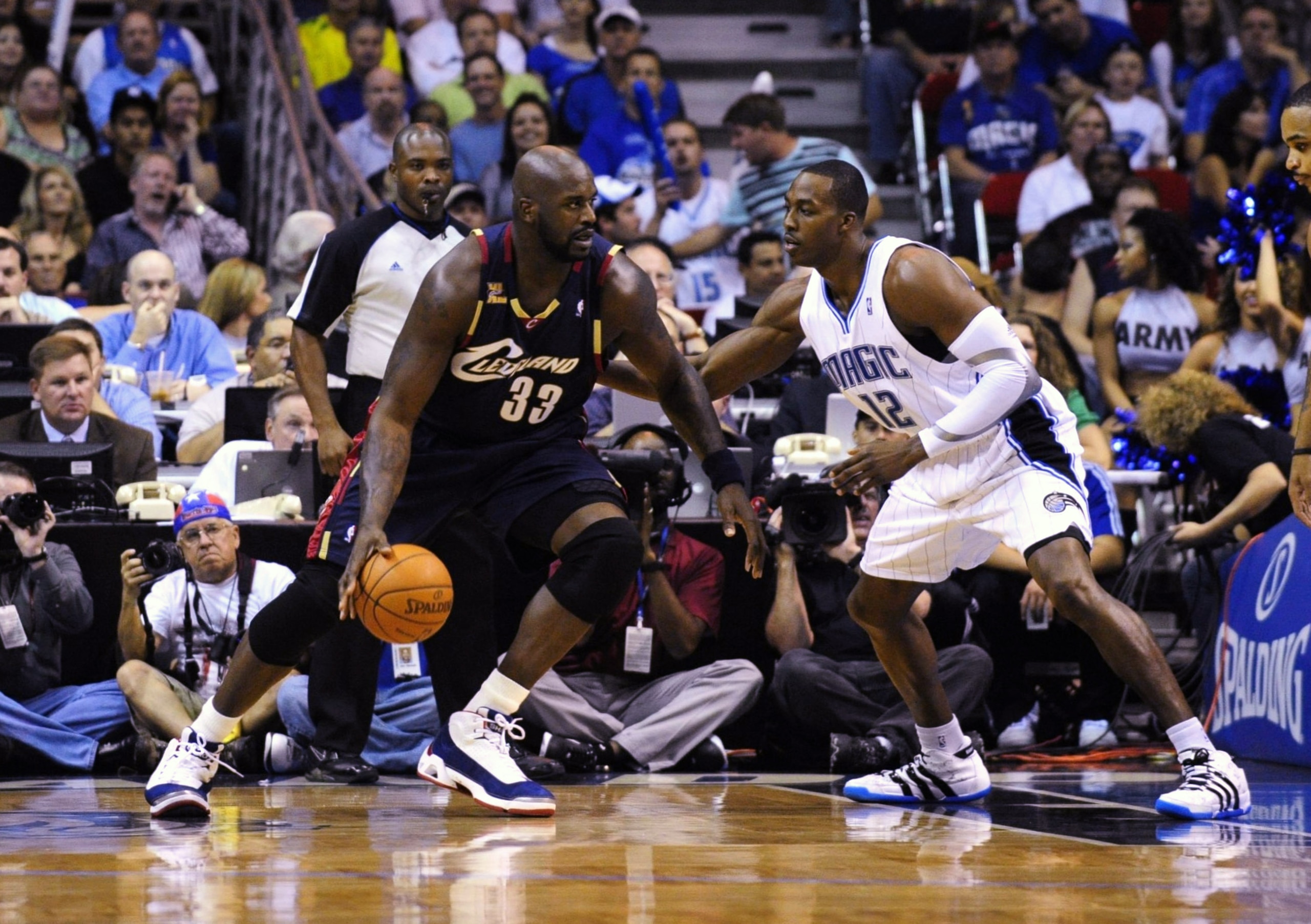 ORLANDO, FL - NOVEMBER 11:  Shaquille O'Neal #33 of the Cleveland Cavaliers looks to maneuver against Dwight Howard #12 of the Orlando Magic during the game on November 11, 2009 at Amway Arena in Orlando, Florida. NOTE TO USER: User expressly acknowledges