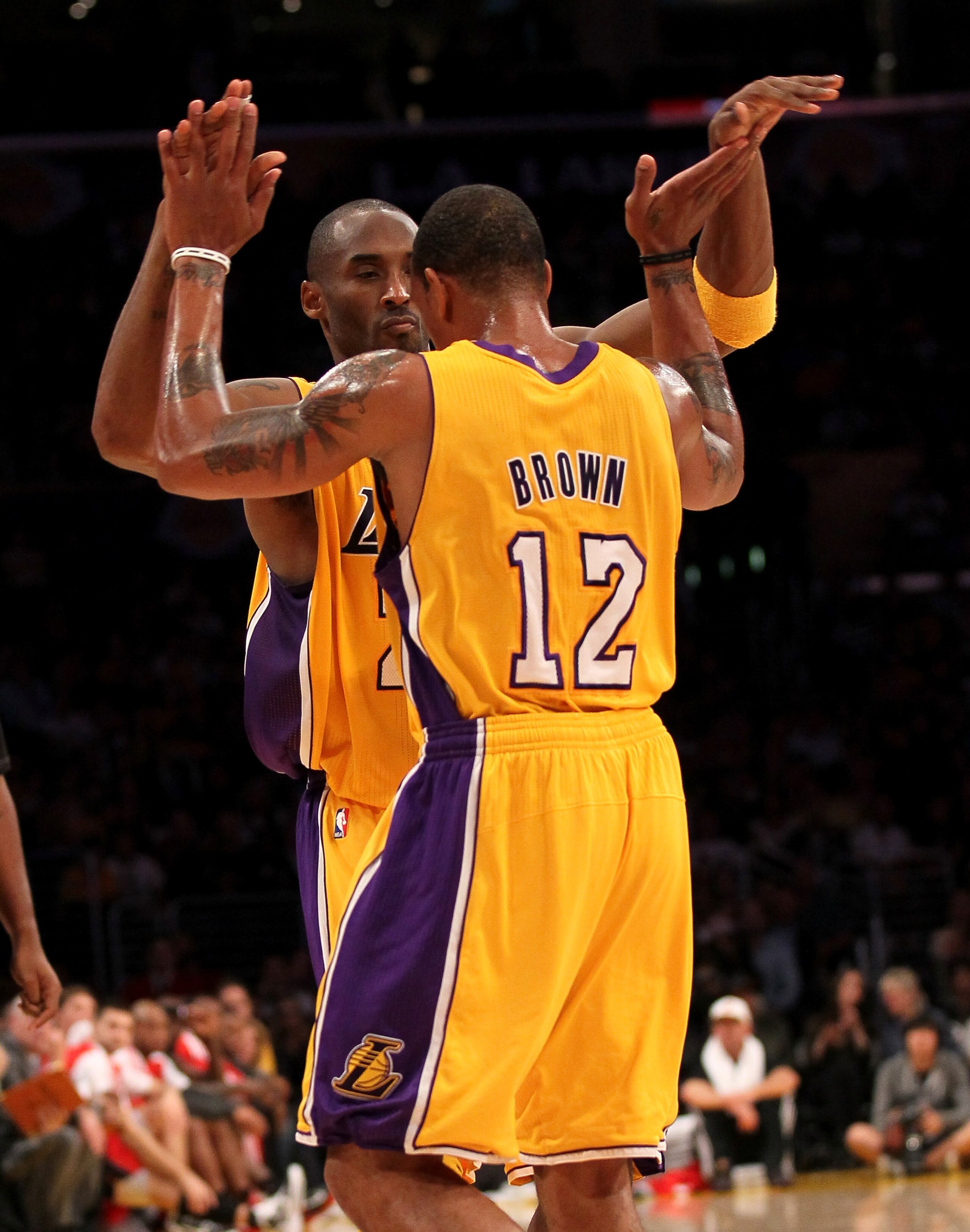 LOS ANGELES - NOVEMBER 5:  Kobe Bryant #24 and Shannon Brown #12 of the Los Angeles Lakers celebrate in the game with the Toronto Raptors at Staples Center on November 5, 2010 in Los Angeles, California.  The Lakers won 108-102.   NOTE TO USER: User expre