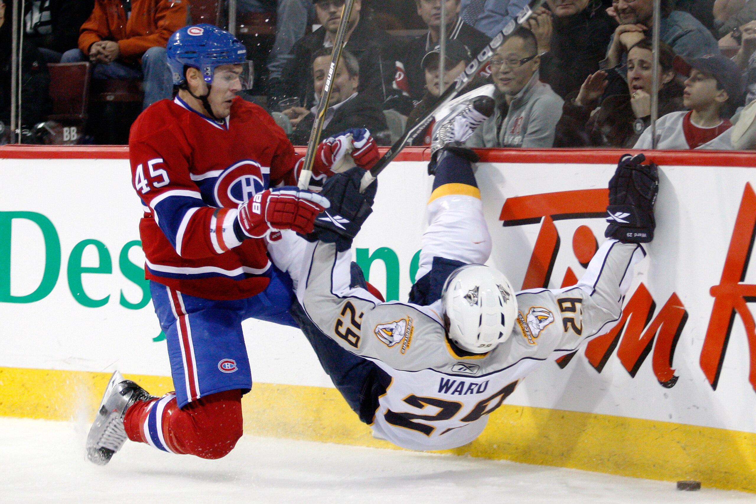 MONTREAL- NOVEMBER 18:  Alexandre Picard #45 of the Montreal Canadiens body checks Joel Ward #29 of the Nashville Predators during the NHL game at the Bell Centre on November 18, 2010 in Montreal, Quebec, Canada.  (Photo by Richard Wolowicz/Getty Images)