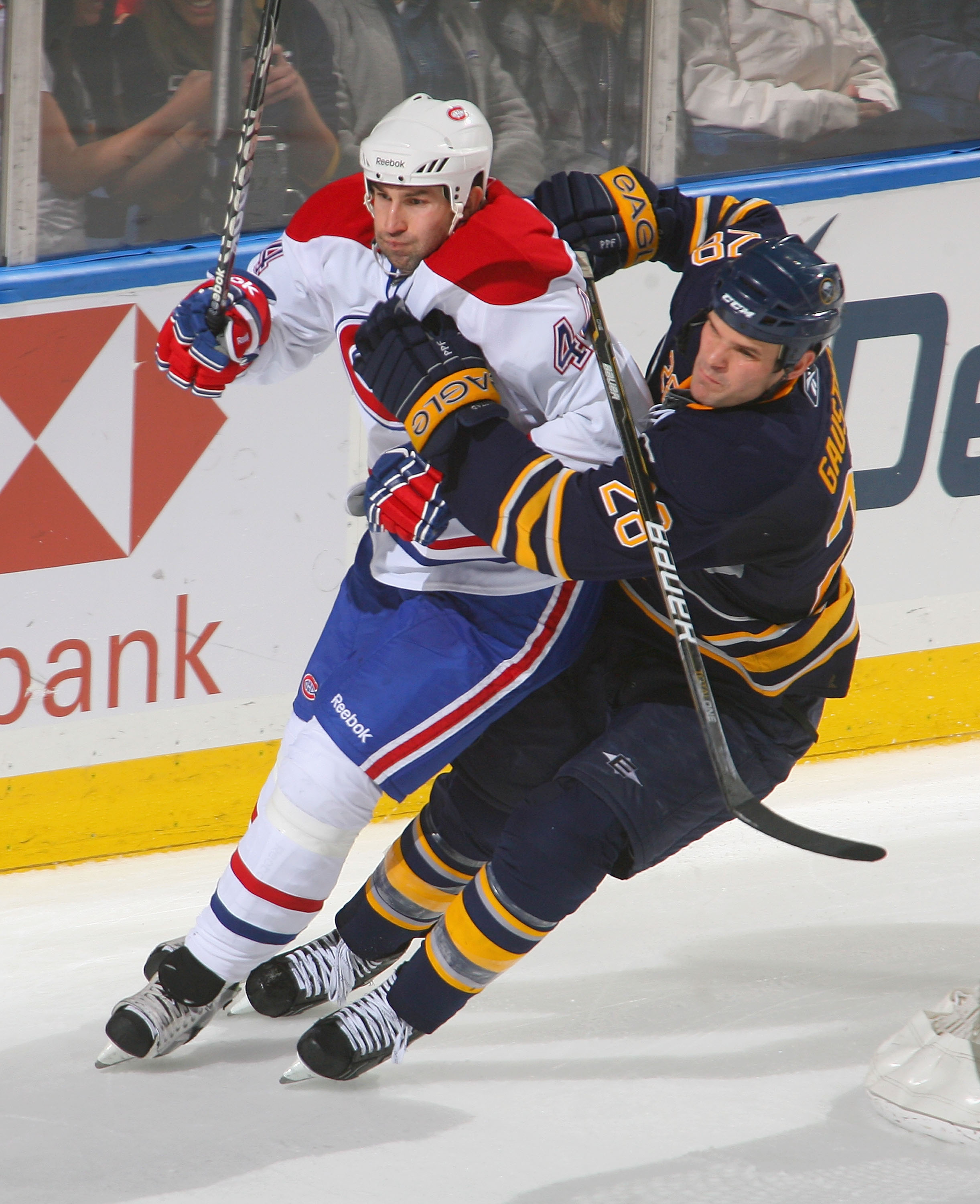 BUFFALO, NY - JANUARY 18: Paul Gaustad #28 of the Buffalo Sabres skates against Roman Hamrlik #44 of the Montreal Canadiens at HSBC Arena on January 18, 2011 in Buffalo, New York.  (Photo by Rick Stewart/Getty Images)