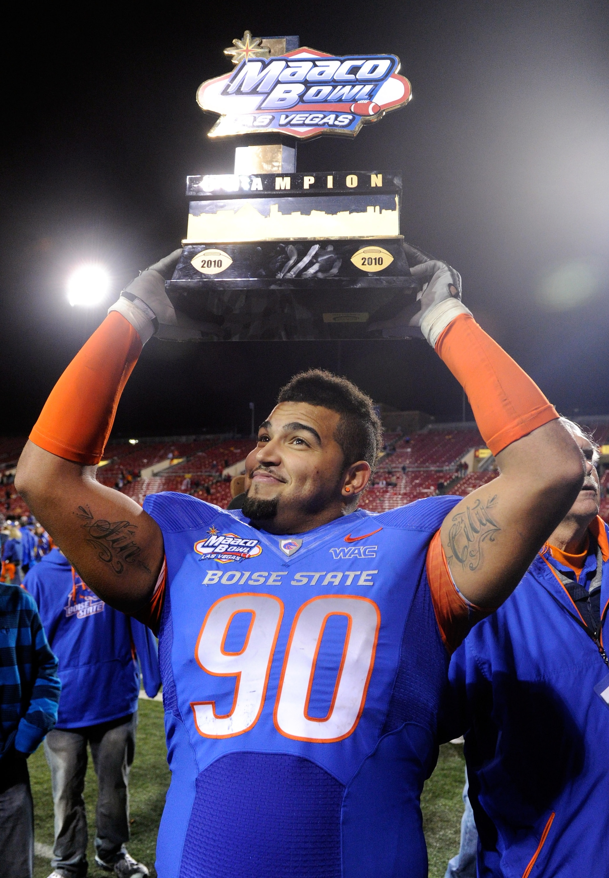 LAS VEGAS, NV - DECEMBER 22: Billy Winn #90 of the Boise State Broncos holds up a trophy as he celebrates the team's 26-3 victory over the Utah Utes in the MAACO Bowl Las Vegas at Sam Boyd Stadium December 22, 2010 in Las Vegas, Nevada. (Photo by Ethan LAS VEGAS, NV - DECEMBER 22: Billy Winn #90 of the Boise State Broncos holds up a trophy as he celebrates the team's 26-3 victory over the Utah Utes in the MAACO Bowl Las Vegas at Sam Boyd Stadium December 22, 2010 in Las Vegas, Nevada. (Photo by Ethan