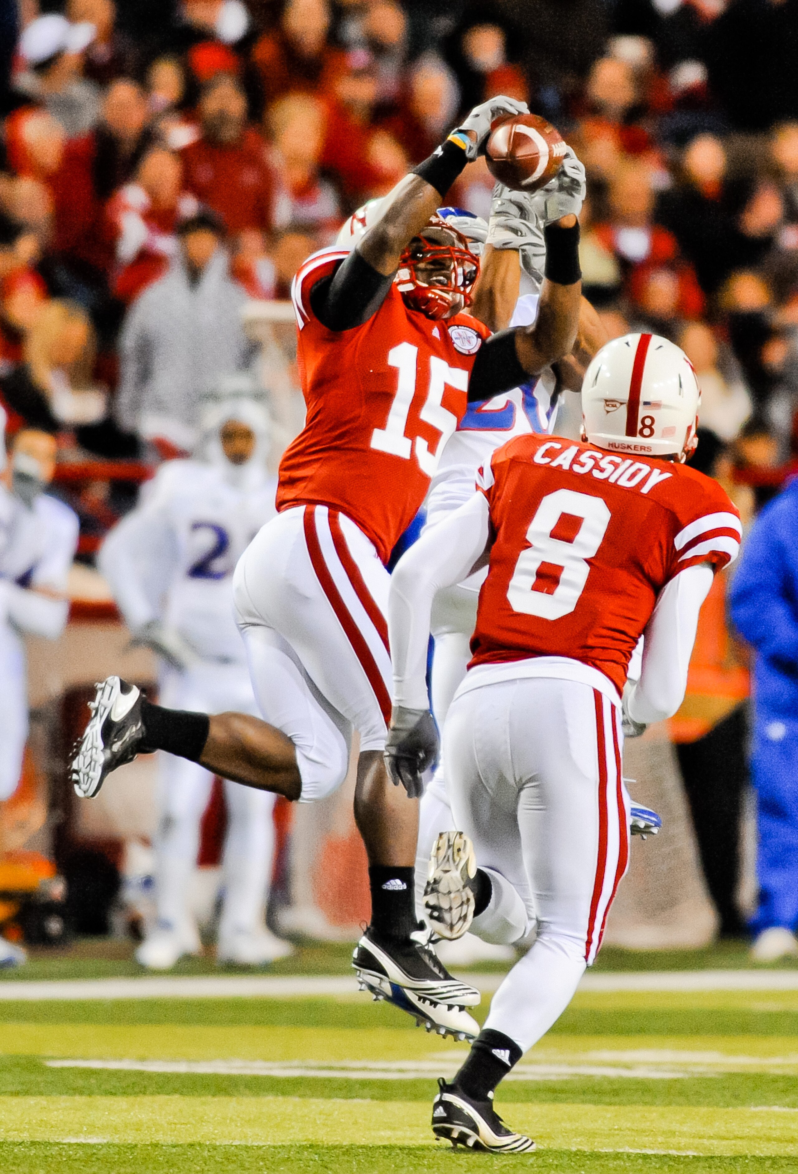 LINCOLN, NE - NOVEMBER 13: Alfonzo Dennard #15 of the Nebraska Cornhuskers takes the ball away from D.J. Beshears #20 of the Kansas Jayhawks during second half action of their game at Memorial Stadium on November 13, 2010 in Lincoln, Nebraska. Nebraska De LINCOLN, NE - NOVEMBER 13: Alfonzo Dennard #15 of the Nebraska Cornhuskers takes the ball away from D.J. Beshears #20 of the Kansas Jayhawks during second half action of their game at Memorial Stadium on November 13, 2010 in Lincoln, Nebraska. Nebraska De