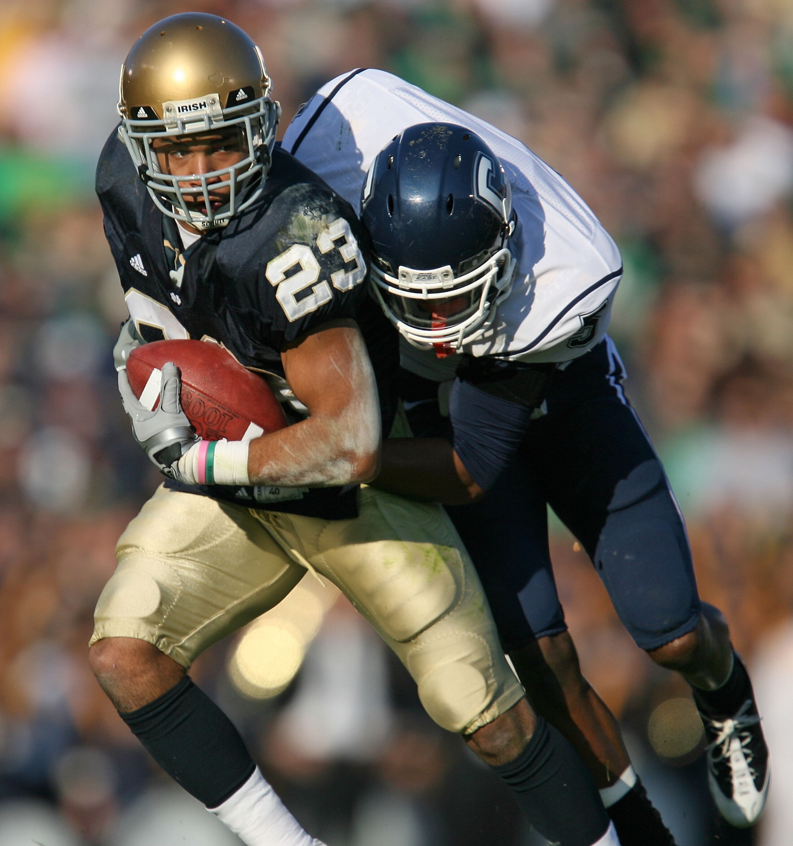 SOUTH BEND, IN - NOVEMBER 21: Golden Tate #23 of the Notre Dame Fighting Irish is hit by Blidi Wreh-Wilson #5 of the Univeristy of Connecticut Huskies at Notre Dame Stadium on November 21, 2009 in South Bend, Indiana. (Photo by Jonathan Daniel/Getty Image SOUTH BEND, IN - NOVEMBER 21: Golden Tate #23 of the Notre Dame Fighting Irish is hit by Blidi Wreh-Wilson #5 of the Univeristy of Connecticut Huskies at Notre Dame Stadium on November 21, 2009 in South Bend, Indiana. (Photo by Jonathan Daniel/Getty Image