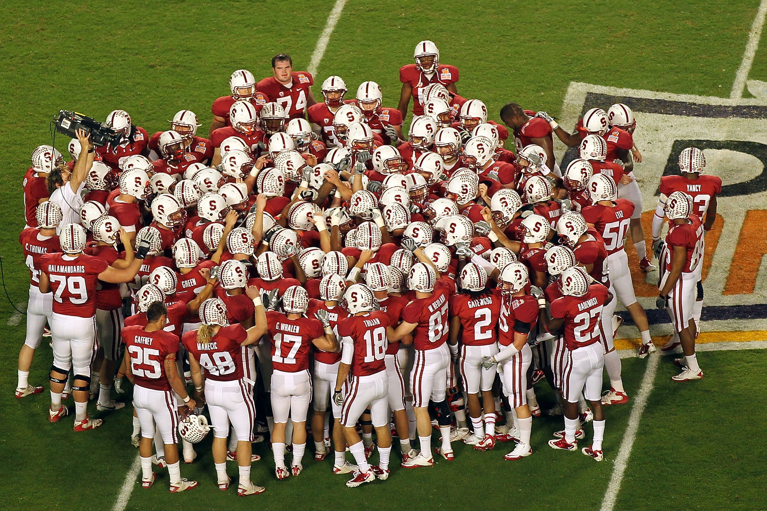 MIAMI, FL - JANUARY 03: The Stanford Cardinal huddle on the field prior to playing against the Virginia Tech Hokies during the 2011 Discover Orange Bowl at Sun Life Stadium on January 3, 2011 in Miami, Florida. Stanford won 40-12. (Photo by Mike Ehrmann/ MIAMI, FL - JANUARY 03: The Stanford Cardinal huddle on the field prior to playing against the Virginia Tech Hokies during the 2011 Discover Orange Bowl at Sun Life Stadium on January 3, 2011 in Miami, Florida. Stanford won 40-12. (Photo by Mike Ehrmann/