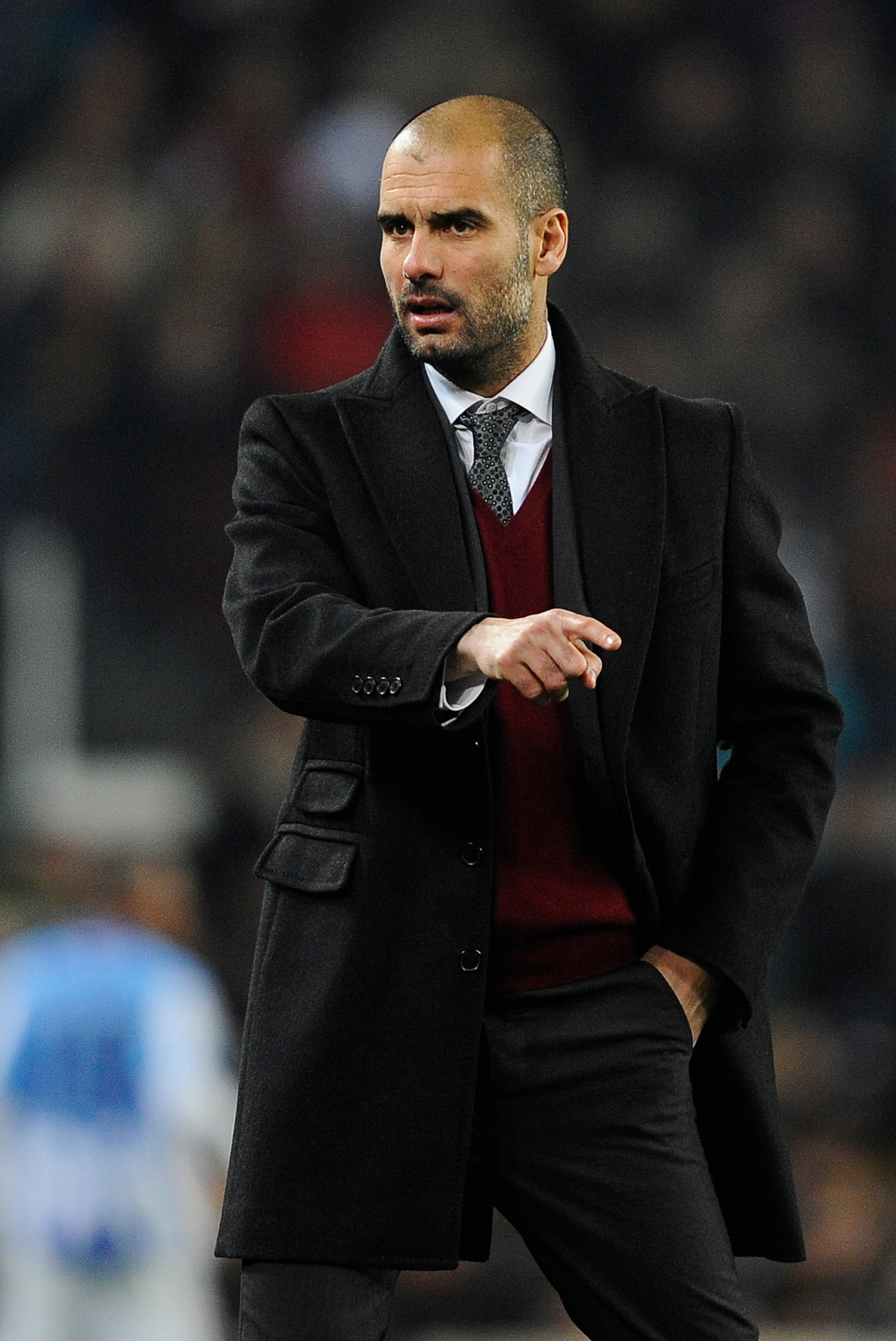 BARCELONA, SPAIN - JANUARY 16:  Head coach Josep Guardila of FC Barcelona reacts during the La Liga match between FC Barcelona and Malaga at Nou Camp on January 16, 2011 in Barcelona, Spain. Barcelona won 4-1.  (Photo by David Ramos/Getty Images)