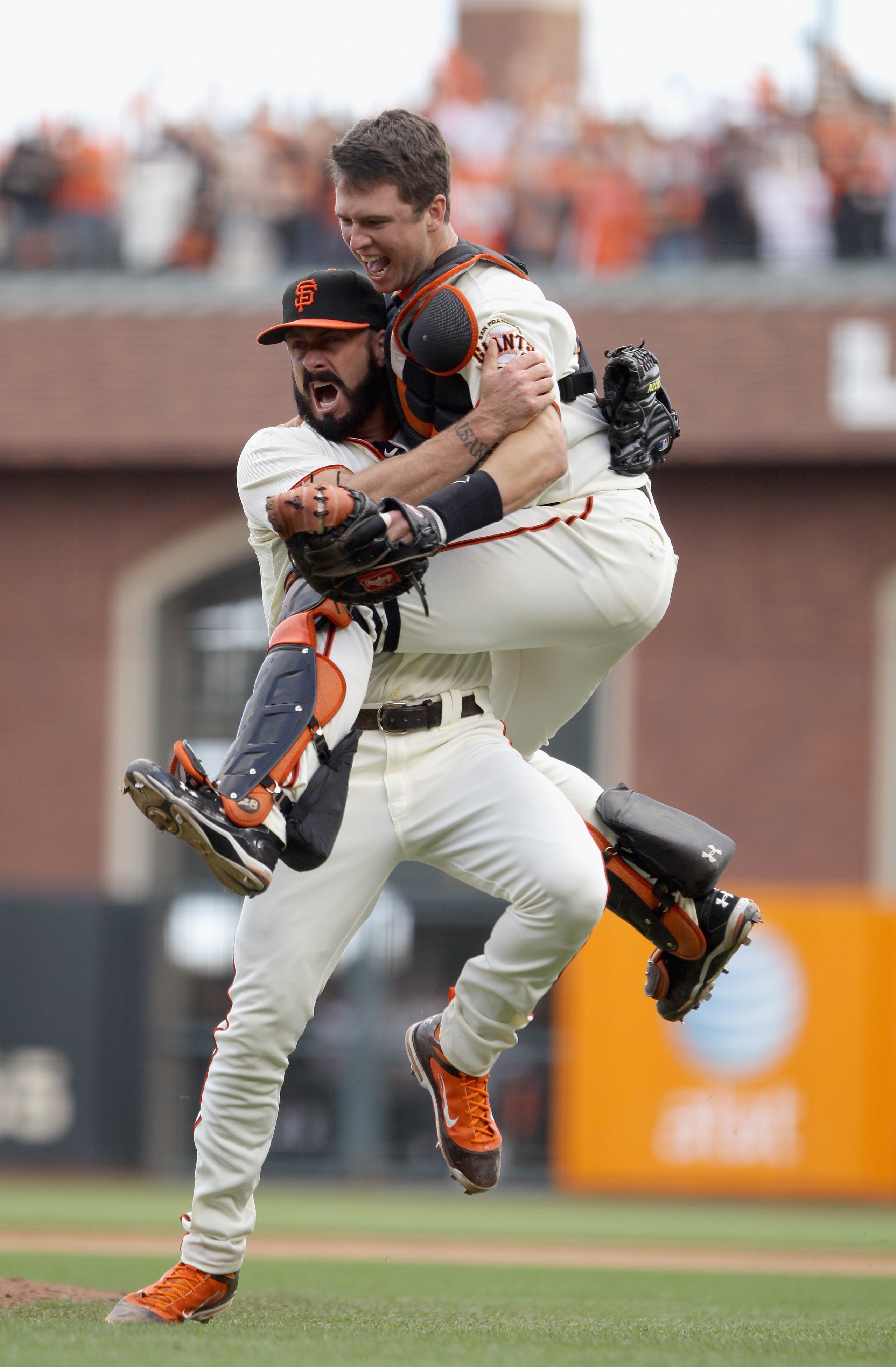 SAN FRANCISCO - OCTOBER 03:  Buster Posey #28 and Brian Wilson #38 of the San Francisco Giants celebrate after they beat the San Diego Padres to win the National League West Title at AT&T Park on October 3, 2010 in San Francisco, California.  (Photo by Ez