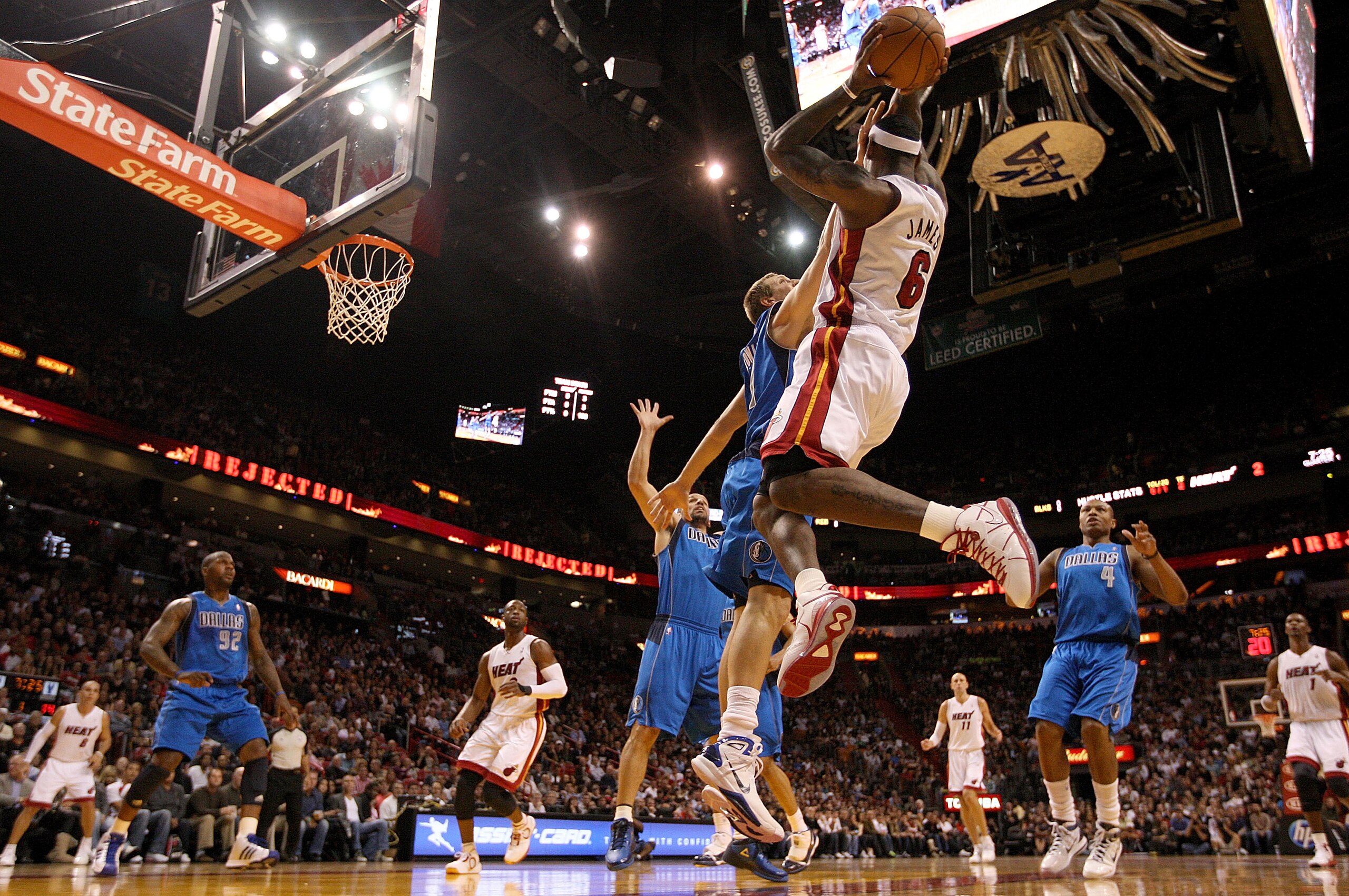 MIAMI, FL - DECEMBER 20:  LeBron James #6 of the Miami Heat passes over Dirk Nowitzki #41 of the Dallas Mavericks  during a game at American Airlines Arena on December 20, 2010 in Miami, Florida. NOTE TO USER: User expressly acknowledges and agrees that,