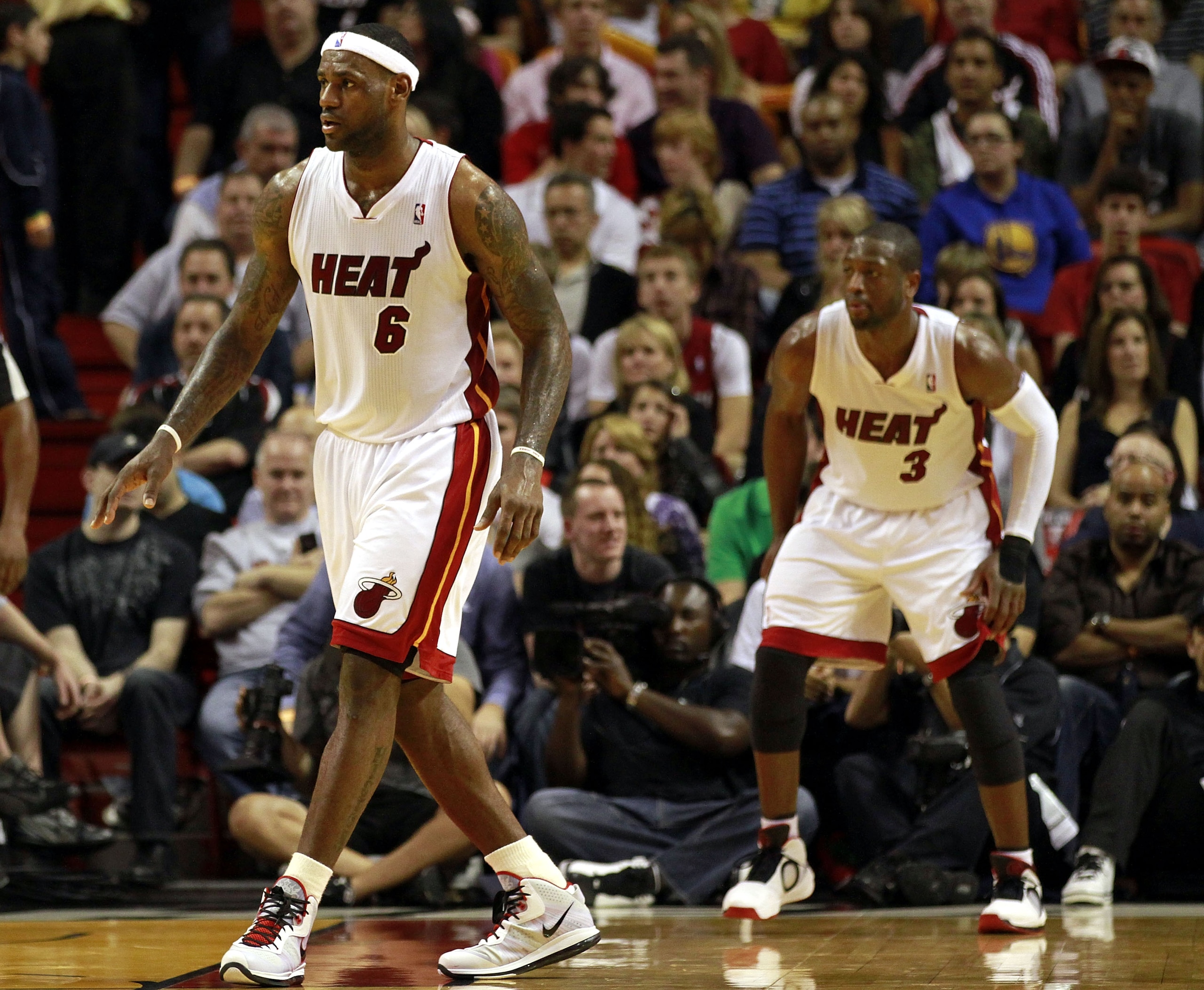 MIAMI - JANUARY 01:  LeBron James #6 and  Dwyane Wade #3 of the Miami Heat are seen on court during the game against the Golden State Warriors at American Airlines Arena on January 1, 2011 in Miami, Florida. NOTE TO USER: User expressly acknowledges and a