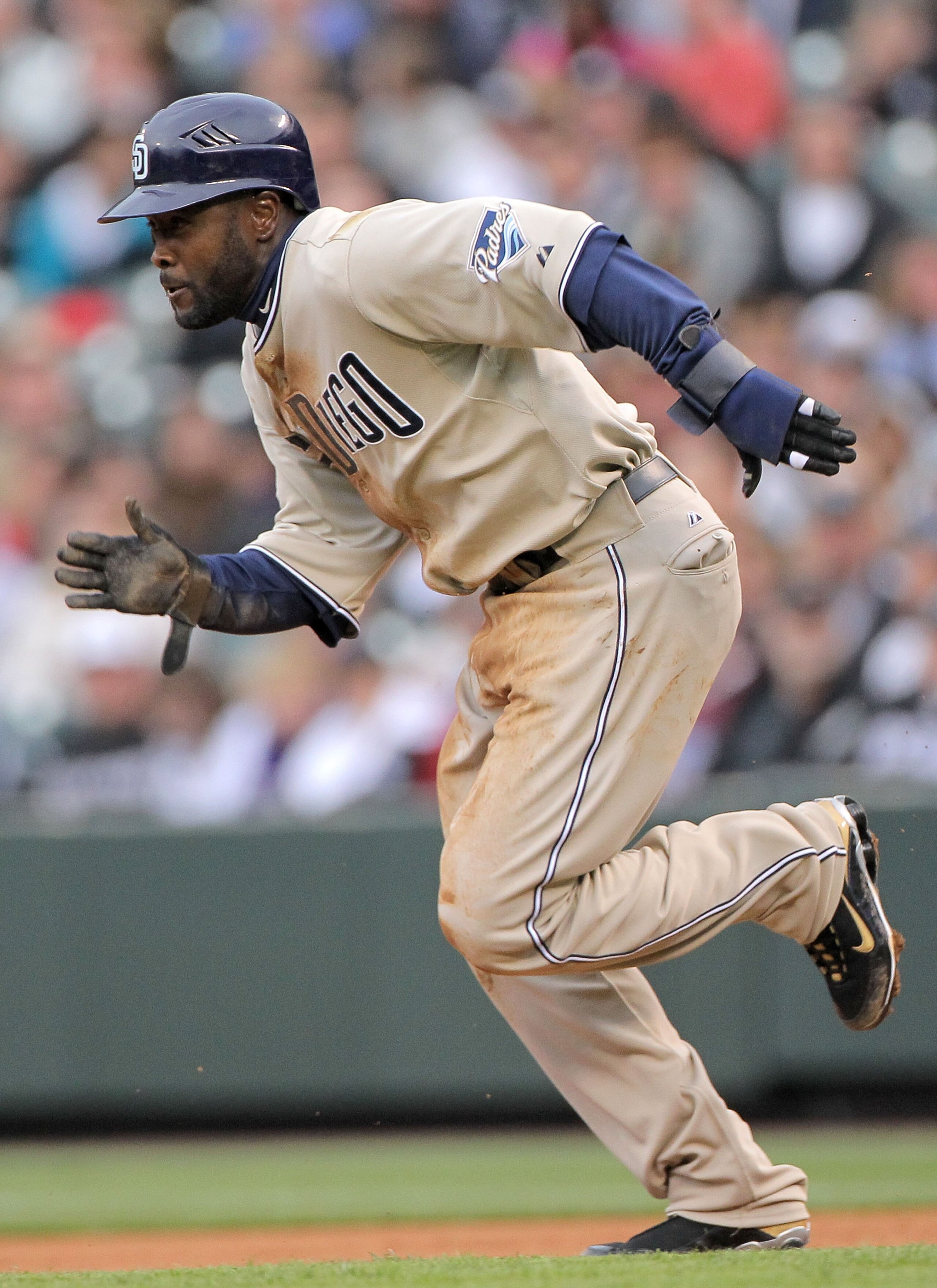 DENVER - APRIL 10:  Centerfielder Tony Gwynn Jr. #18 of the San Diego Padres steals secondbase against starting pitcher Jason Hammel of the Colorado Rockies during MLB action at Coors Field on April 10, 2010 in Denver, Colorado. The Padres defeated the Ro