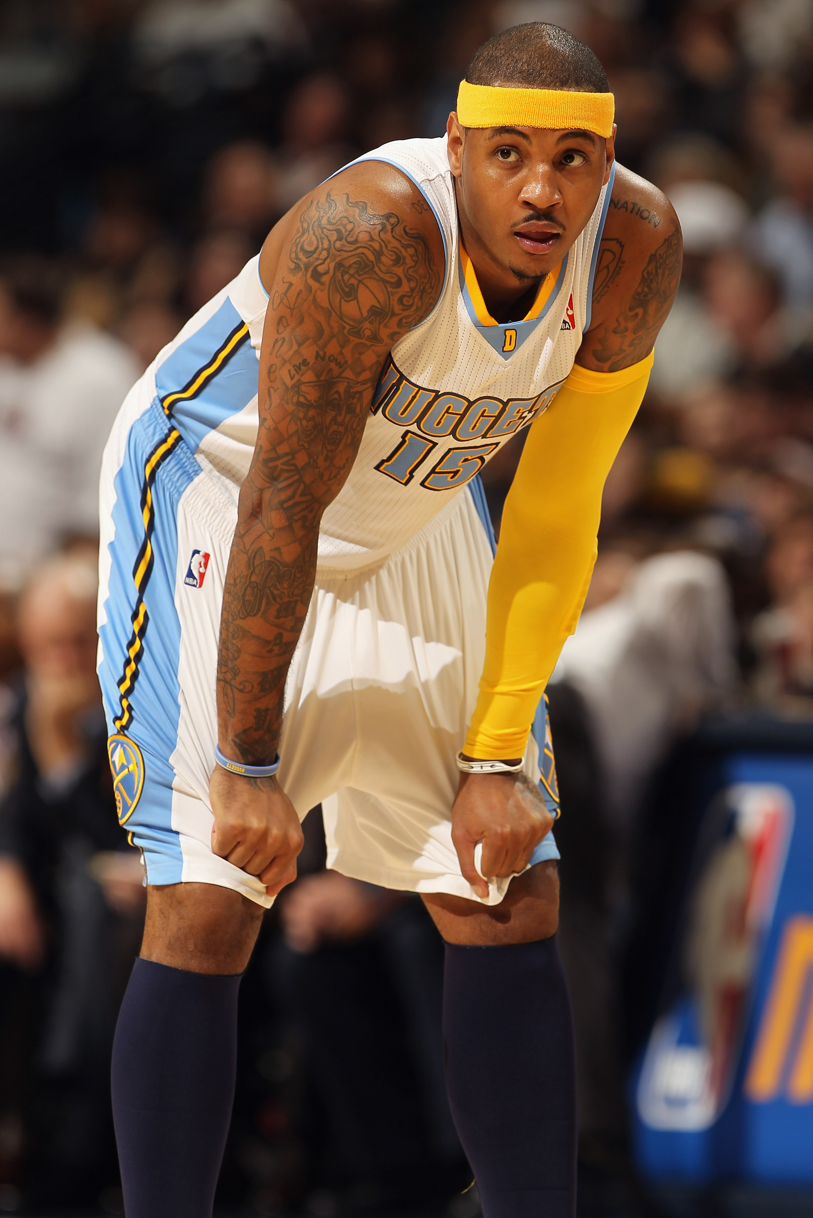 DENVER, CO - JANUARY 13:  Carmelo Anthony #15 of the Denver Nuggets looks on during a break in the action against the Miami Heat at the Pepsi Center on January 13, 2011 in Denver, Colorado. The Nuggets defeated the Heat 130-102. NOTE TO USER: User express