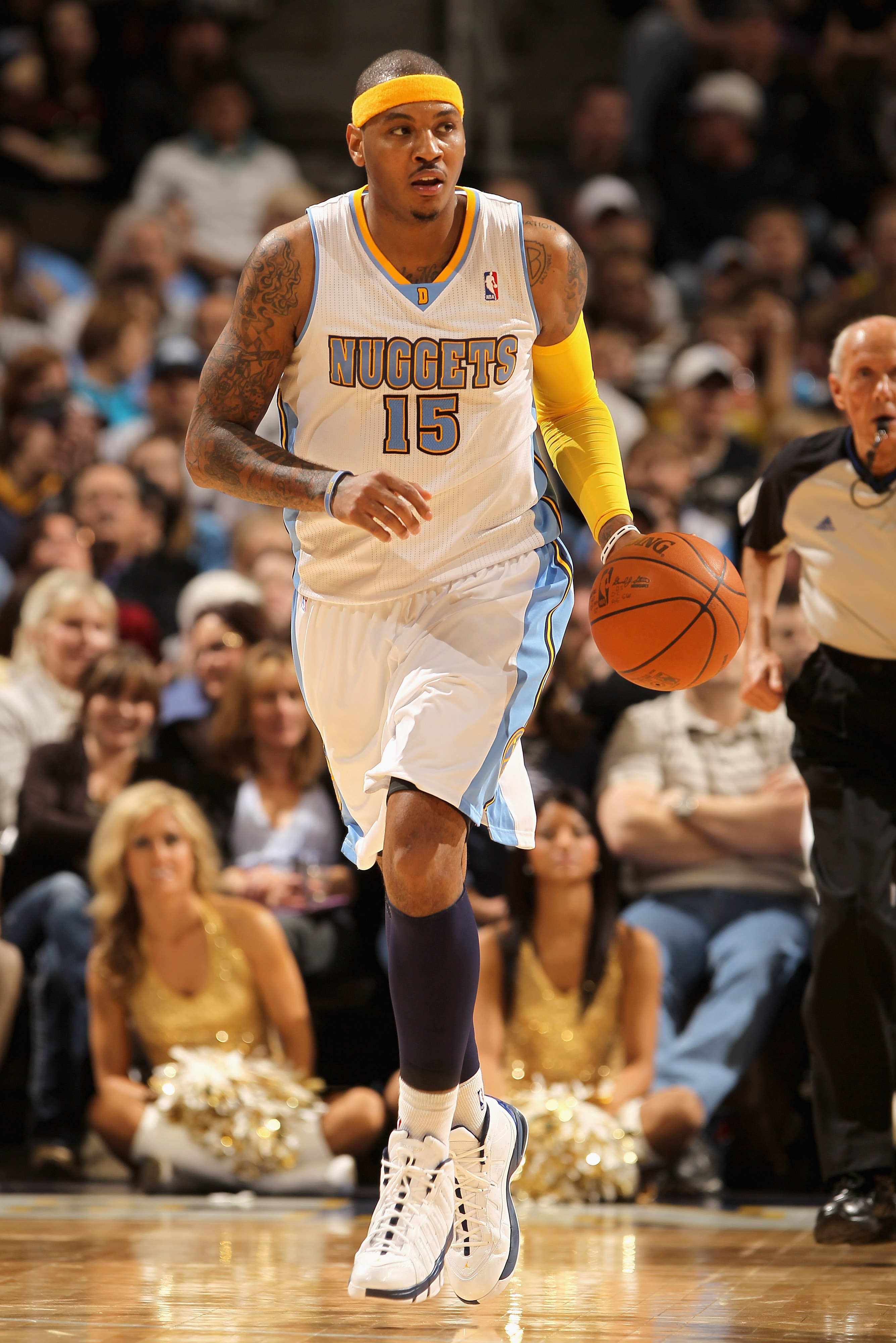 DENVER, CO - JANUARY 13:  Carmelo Anthony #15 of the Denver Nuggets dribbles the ball upcourt against the Miami Heat at the Pepsi Center on January 13, 2011 in Denver, Colorado. The Nuggets defeated the Heat 130-102. NOTE TO USER: User expressly acknowled
