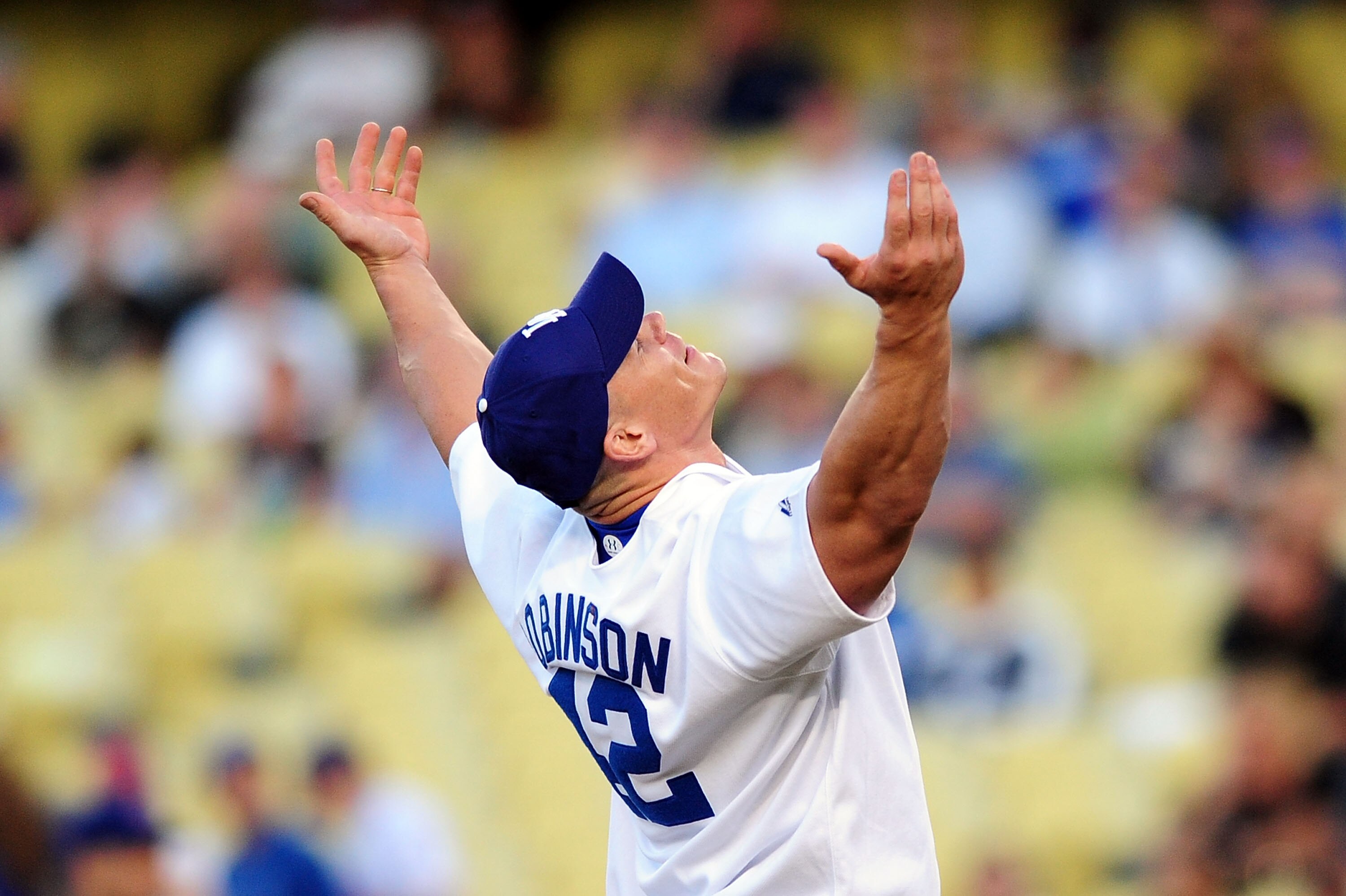 LOS ANGELES, CA - AUGUST 20: WWE Superstar John Cena throws the ceremonial first pitch for the Los Angeles Dodgers as they play the Chicago Cubs on August 20, 2009 at Dodger Stadium in Los Angeles, California. (Photo by Jacob de Golish/Getty Images)