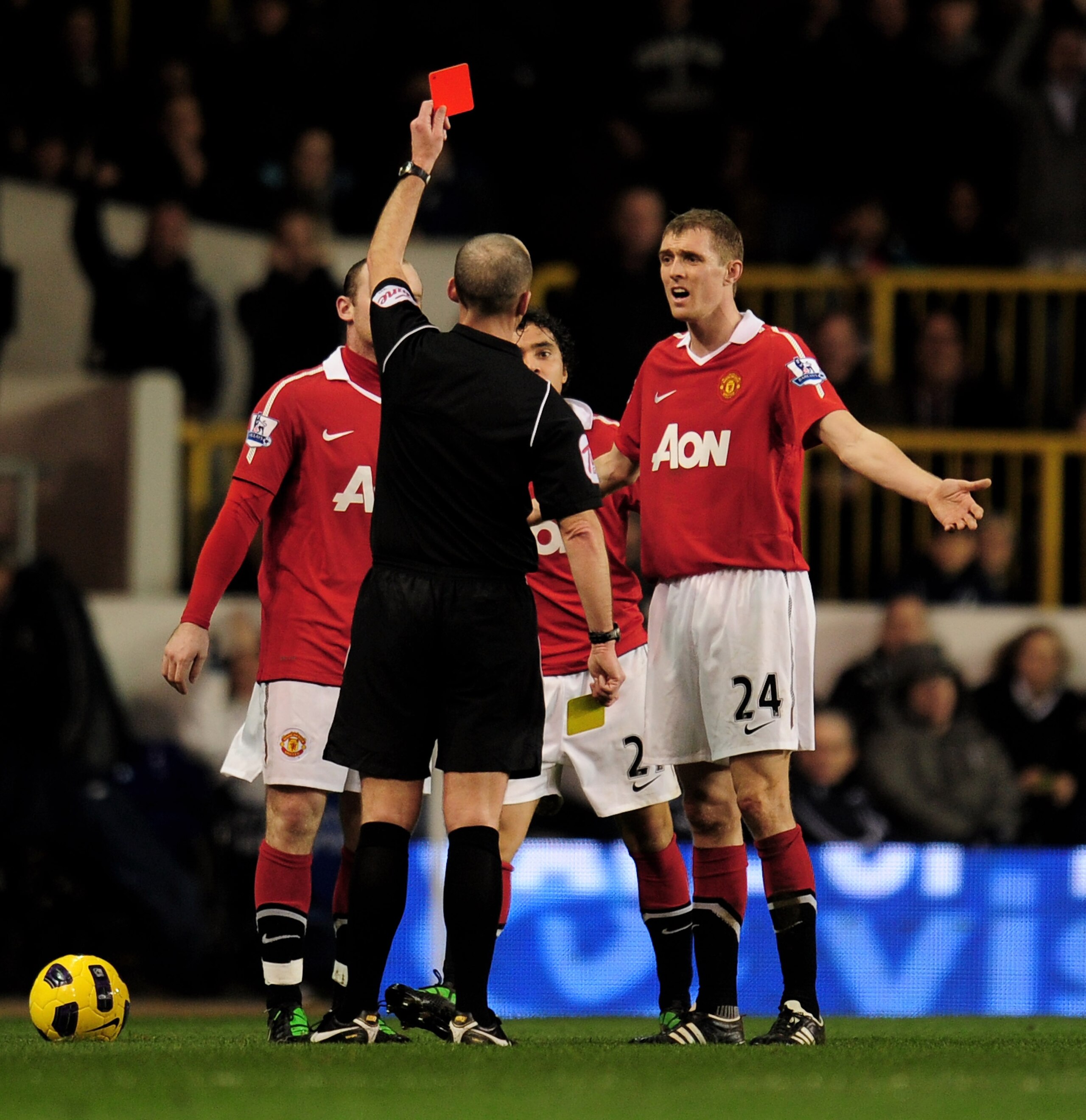 LONDON, ENGLAND - JANUARY 16:  Rafael Da Silva (centre-obscured) of Manchester United reacts as he is shown the red card following his second bookable offence by Referee Mike Dean during the Barclays Premier League match between Tottenham Hotspur and Manc