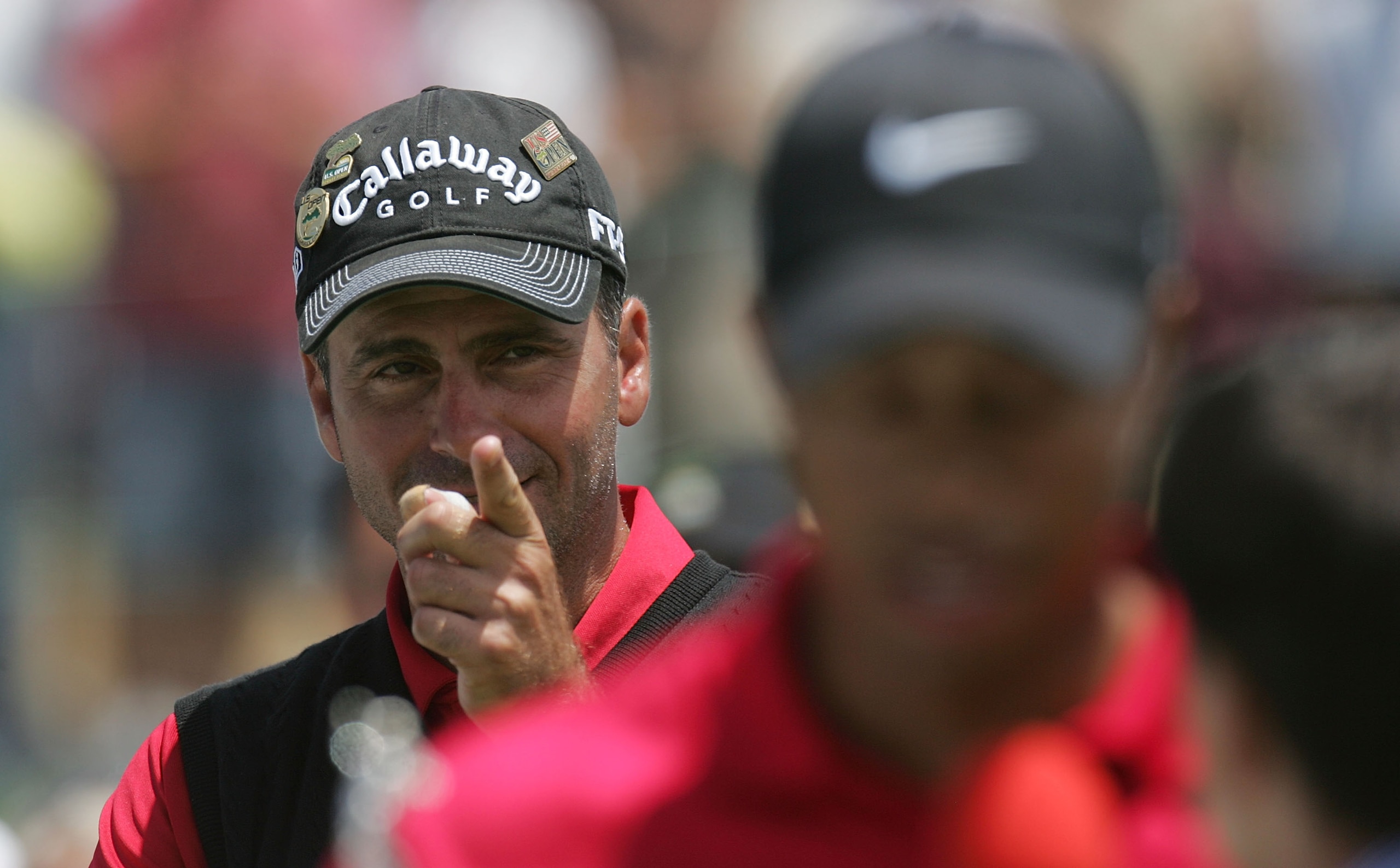 SAN DIEGO - JUNE 16:  Tiger Woods walks away from runner-up Rocco Mediate after winning on the first sudden death playoff hole during the playoff round of the 108th U.S. Open at the Torrey Pines Golf Course (South Course) on June 16, 2008 in San Diego, Ca