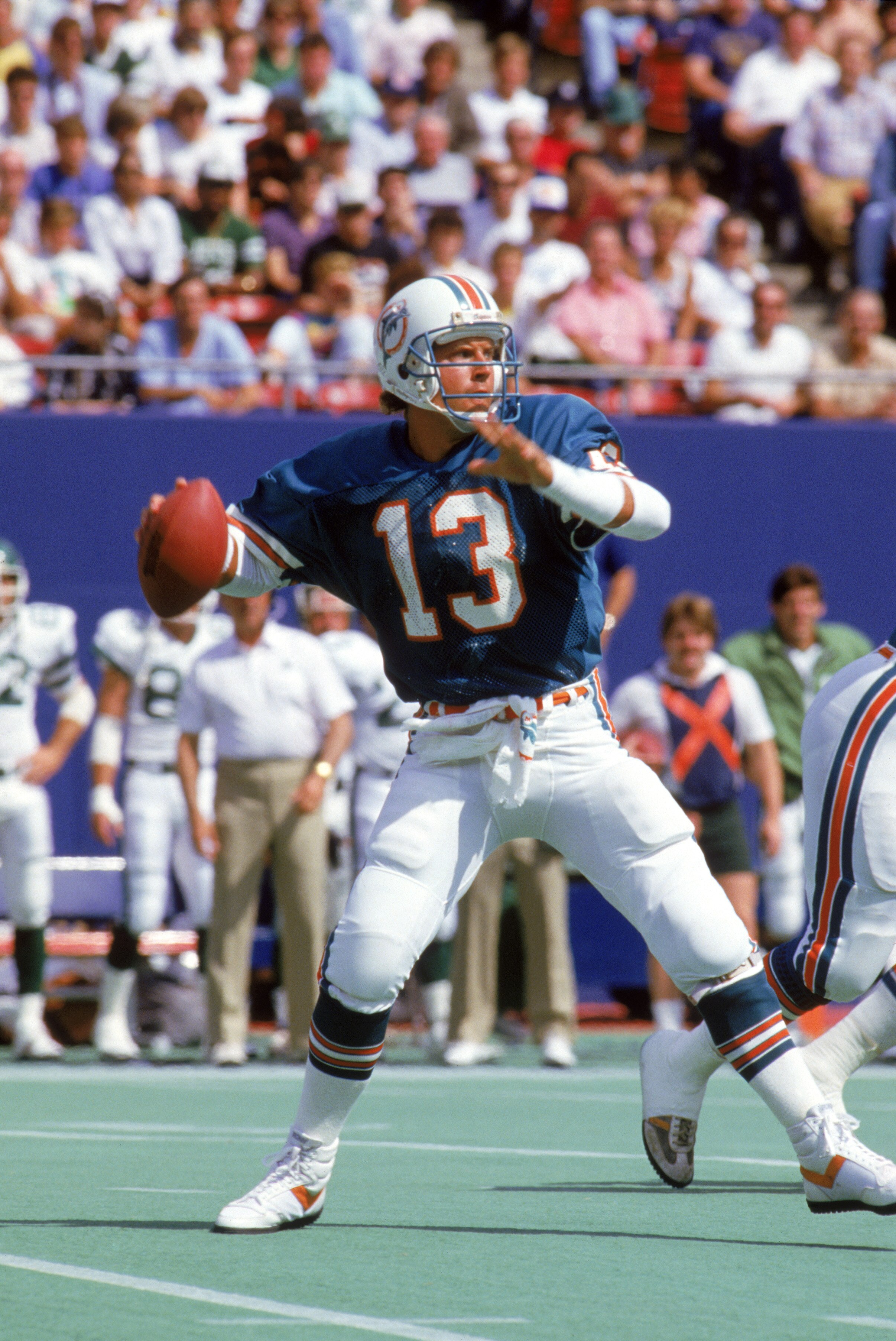 EAST RUTHERFORD, NJ - SEPTEMBER 21:  Quarterback Dan Marino #13 of the Miami Dolphins looks to pass during a game against the New York Jets at Giants Stadium on September 21, 1986 in East Rutherford, New Jersey.  The Jets won 51-45 in overtime.  (Photo by
