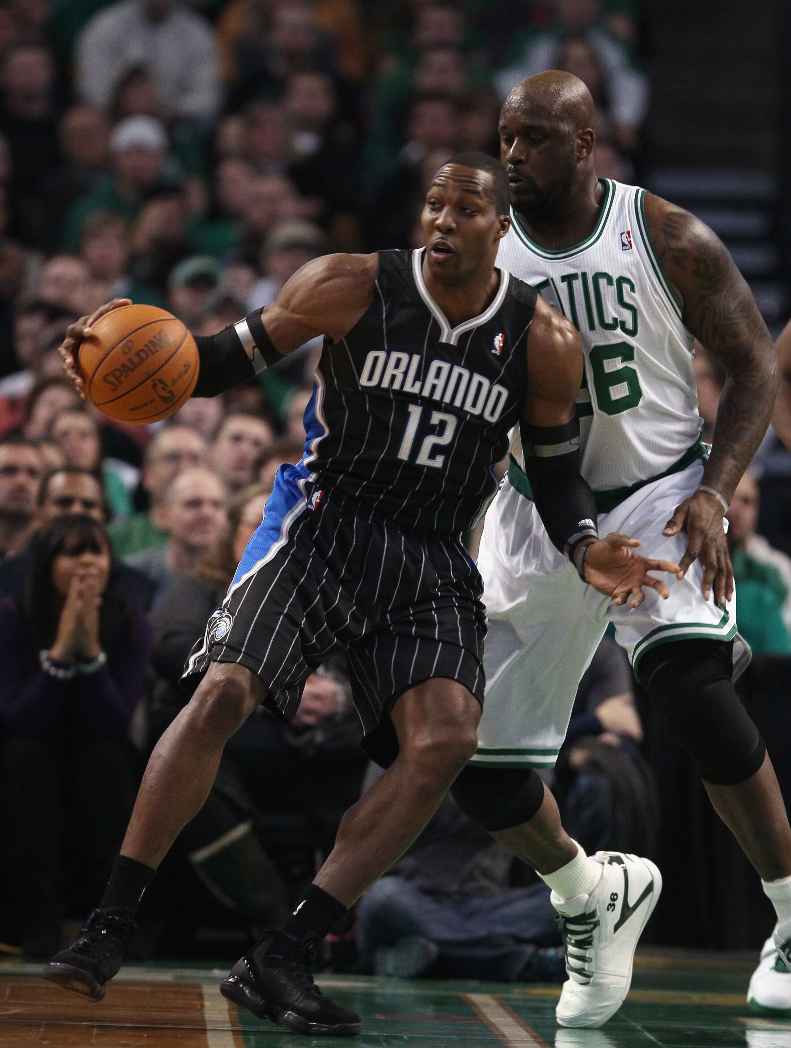 BOSTON, MA - JANUARY 17:  Dwight Howard #12 of the Orlando Magic tries to get around Shaquille O'Neal #36 of the Boston Celtics on January 17, 2011 at the TD Garden in Boston, Massachusetts.  NOTE TO USER: User expressly acknowledges and agrees that, by d