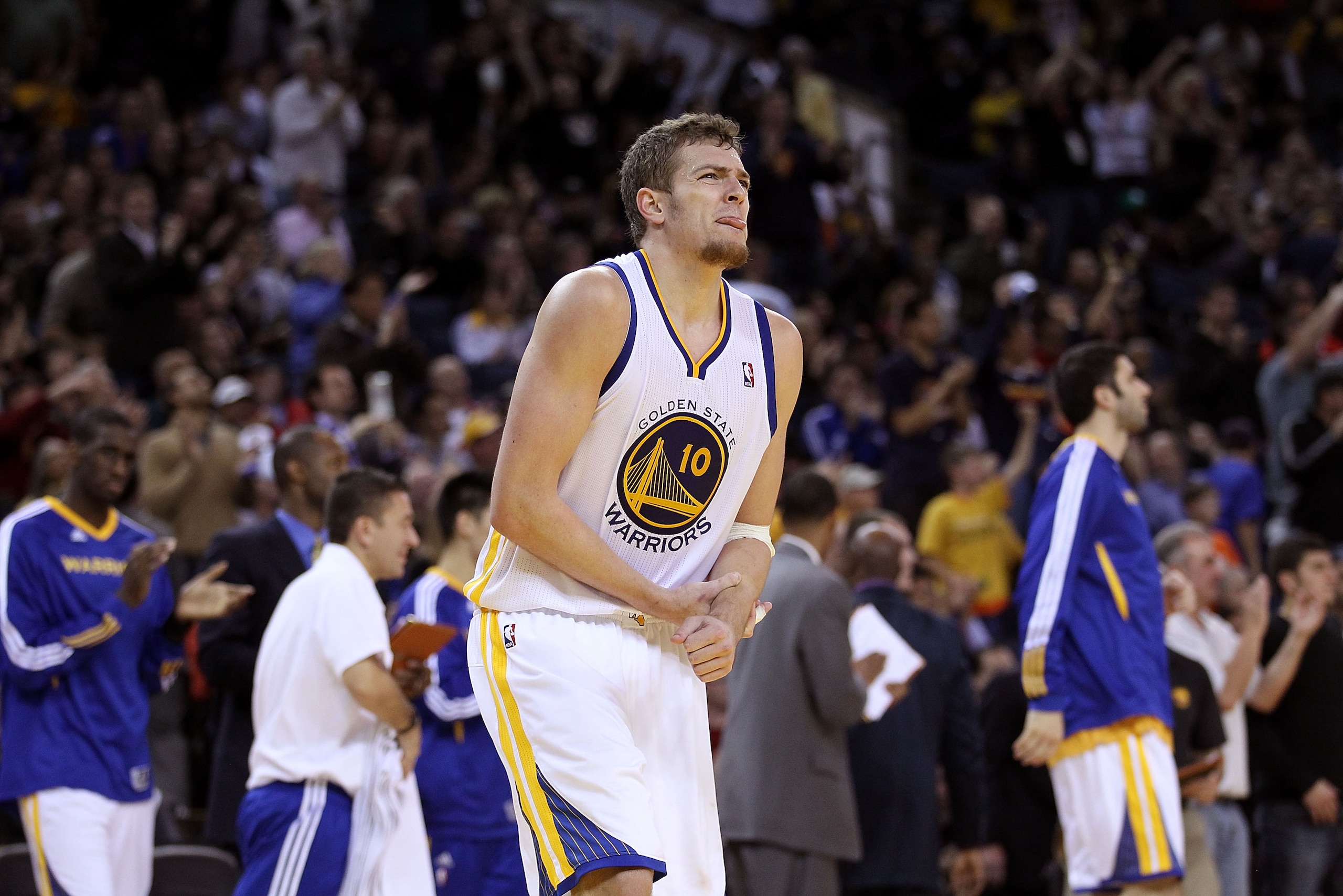 OAKLAND, CA - DECEMBER 14:  David Lee #10 of the Golden State Warriors grabs his wrist after getting hit during their game against the Minnesota Timberwolves at Oracle Arena on December 14, 2010 in Oakland, California.  NOTE TO USER: User expressly acknow