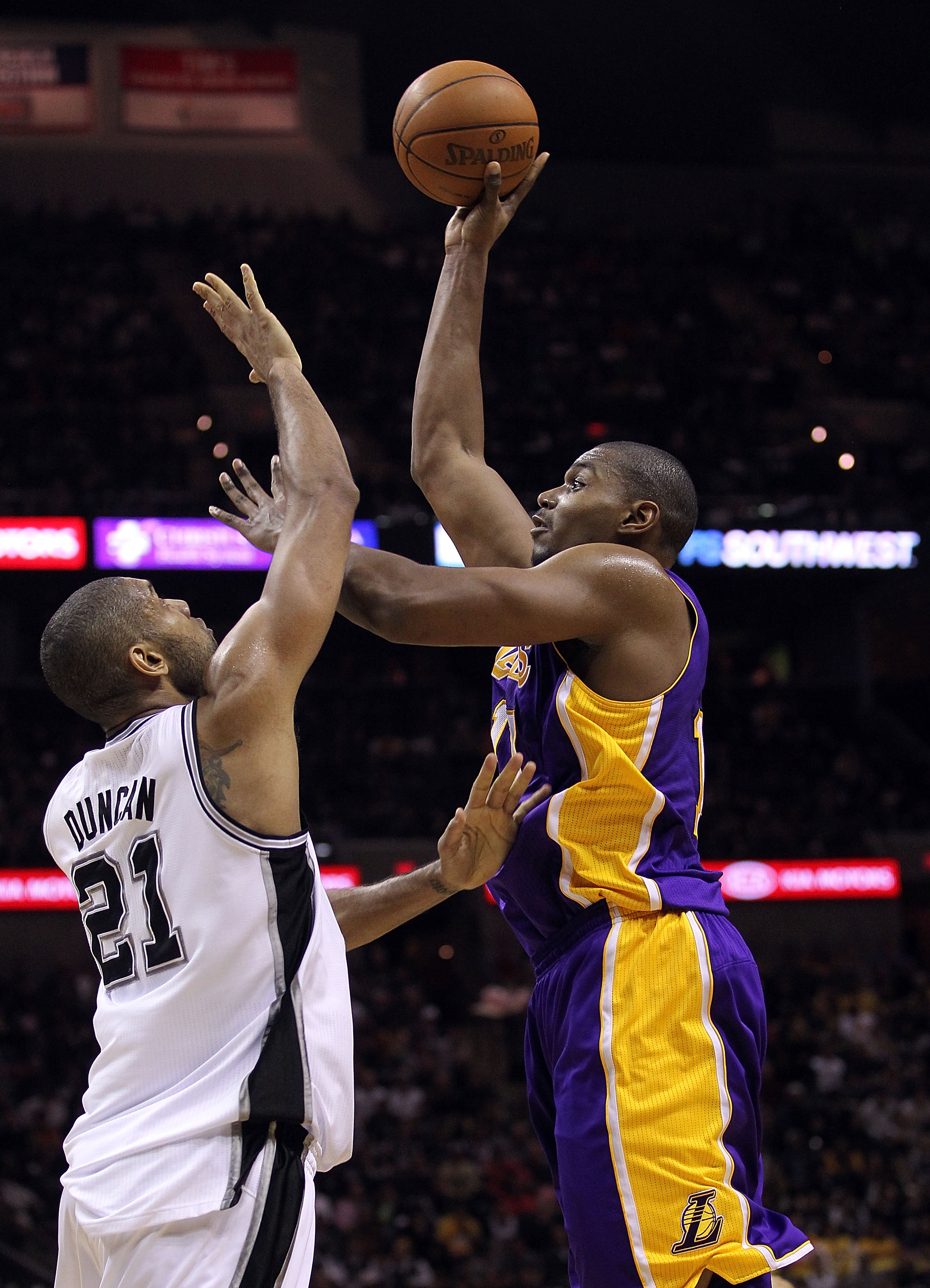 SAN ANTONIO, TX - DECEMBER 28:  Center Andrew Bynum #17 of the Los Angeles Lakers takes a shot against Tim Duncan #21 of the San Antonio Spurs at AT&T Center on December 28, 2010 in San Antonio, Texas.  NOTE TO USER: User expressly acknowledges and agrees