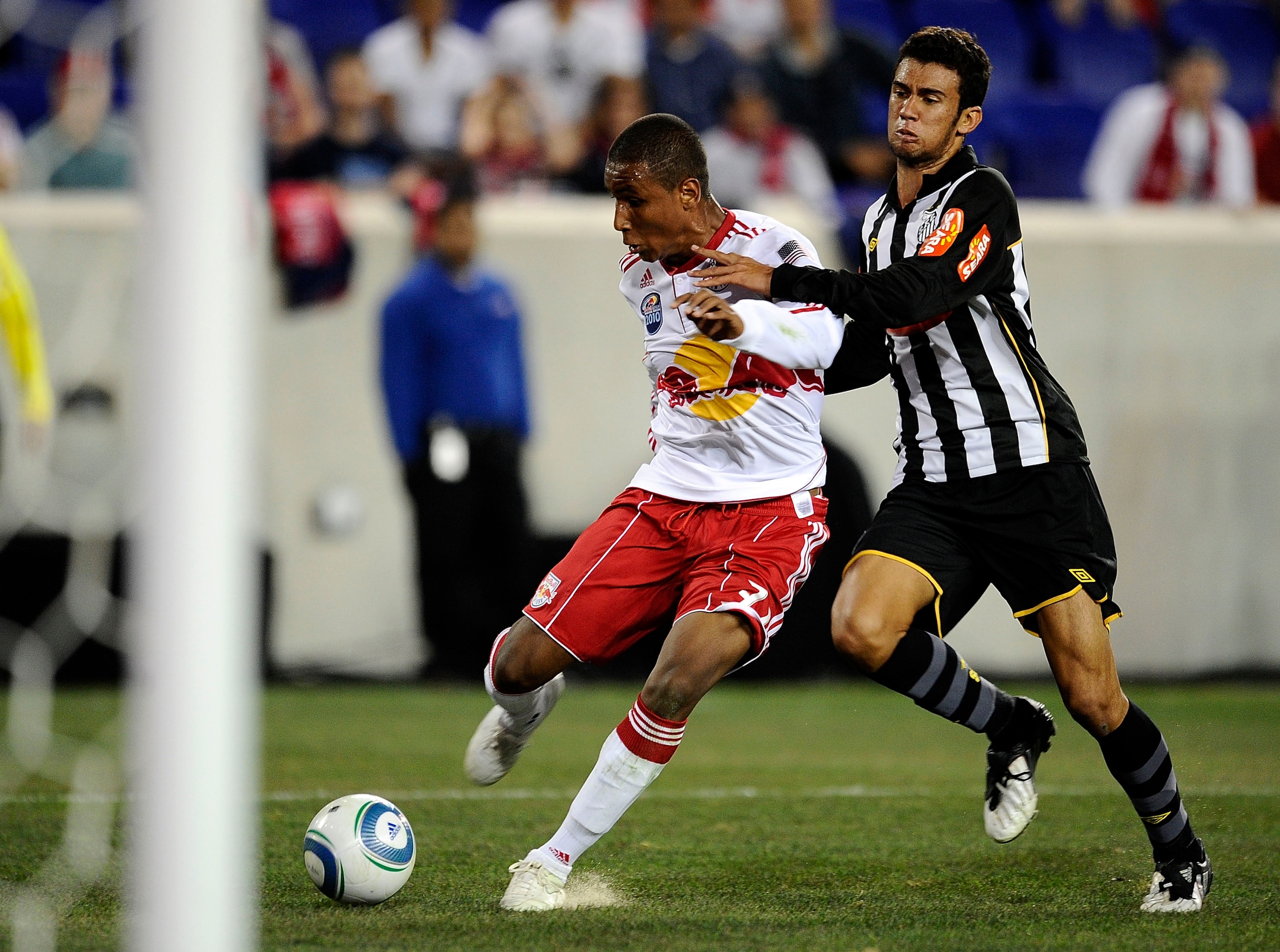 HARRISON, NJ - MARCH 20: Juan Agudelo #31 of the New York Red Bulls fights for the ball with Luciano Castan #6 of Santos FC during the first match played at Red Bull Arena on March 20, 2010 in Harrison, New Jersey. (Photo by Jeff Zelevansky/Getty Images HARRISON, NJ - MARCH 20: Juan Agudelo #31 of the New York Red Bulls fights for the ball with Luciano Castan #6 of Santos FC during the first match played at Red Bull Arena on March 20, 2010 in Harrison, New Jersey. (Photo by Jeff Zelevansky/Getty Images