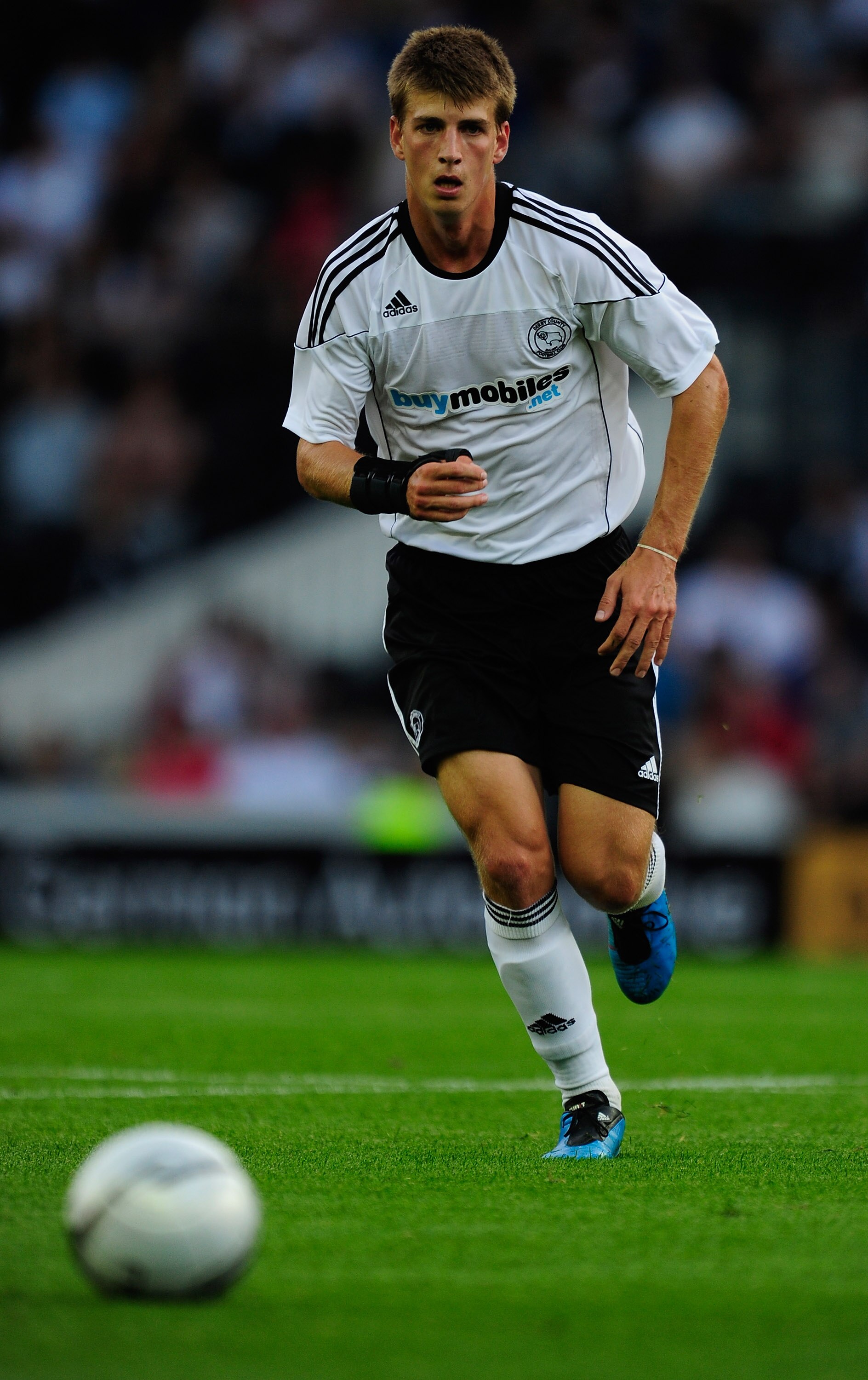 DERBY, ENGLAND - JULY 27:  Conor Doyle of Derby County runs with the ball during the pre-season friendly match between Derby County and Stoke City at Pride Park Stadium on July 27, 2010 in Derby, England.  (Photo by Jamie McDonald/Getty Images)