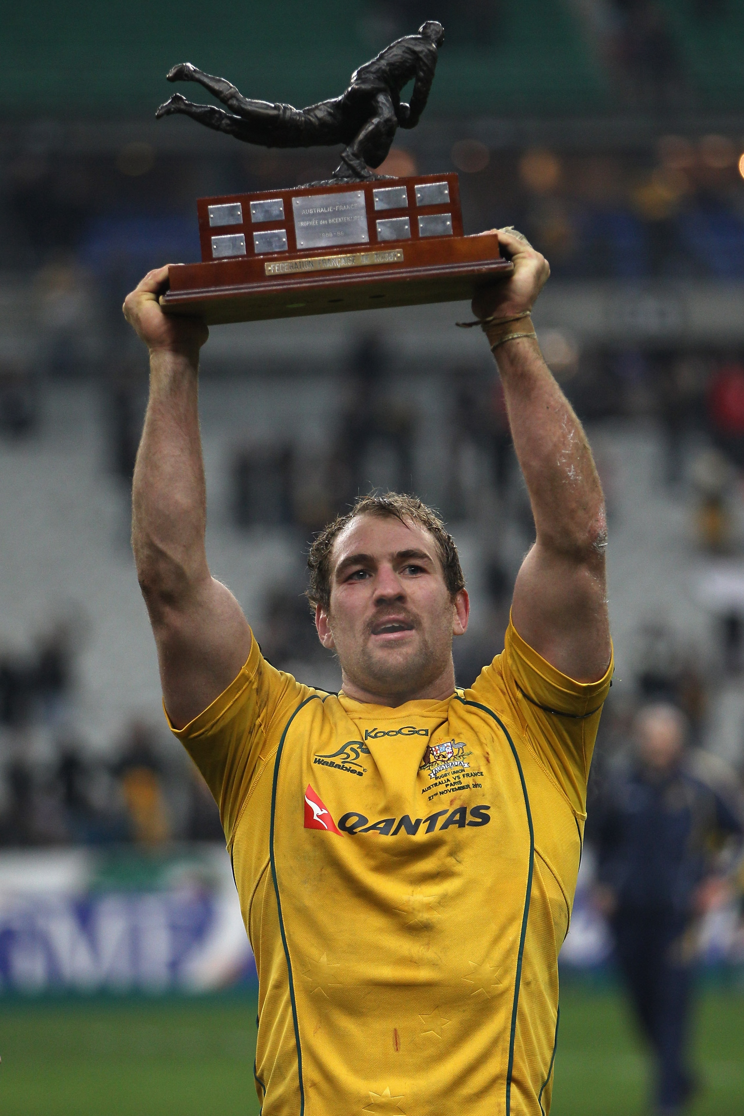 PARIS - NOVEMBER 27: Wallabies captain Rocky Elsom holds aloft the trophy after his side 59-16 victory during the Test match between France and the Australian Wallabies at the Stade de France on November 27, 2010 in Paris.  (Photo by Michael Steele/Getty