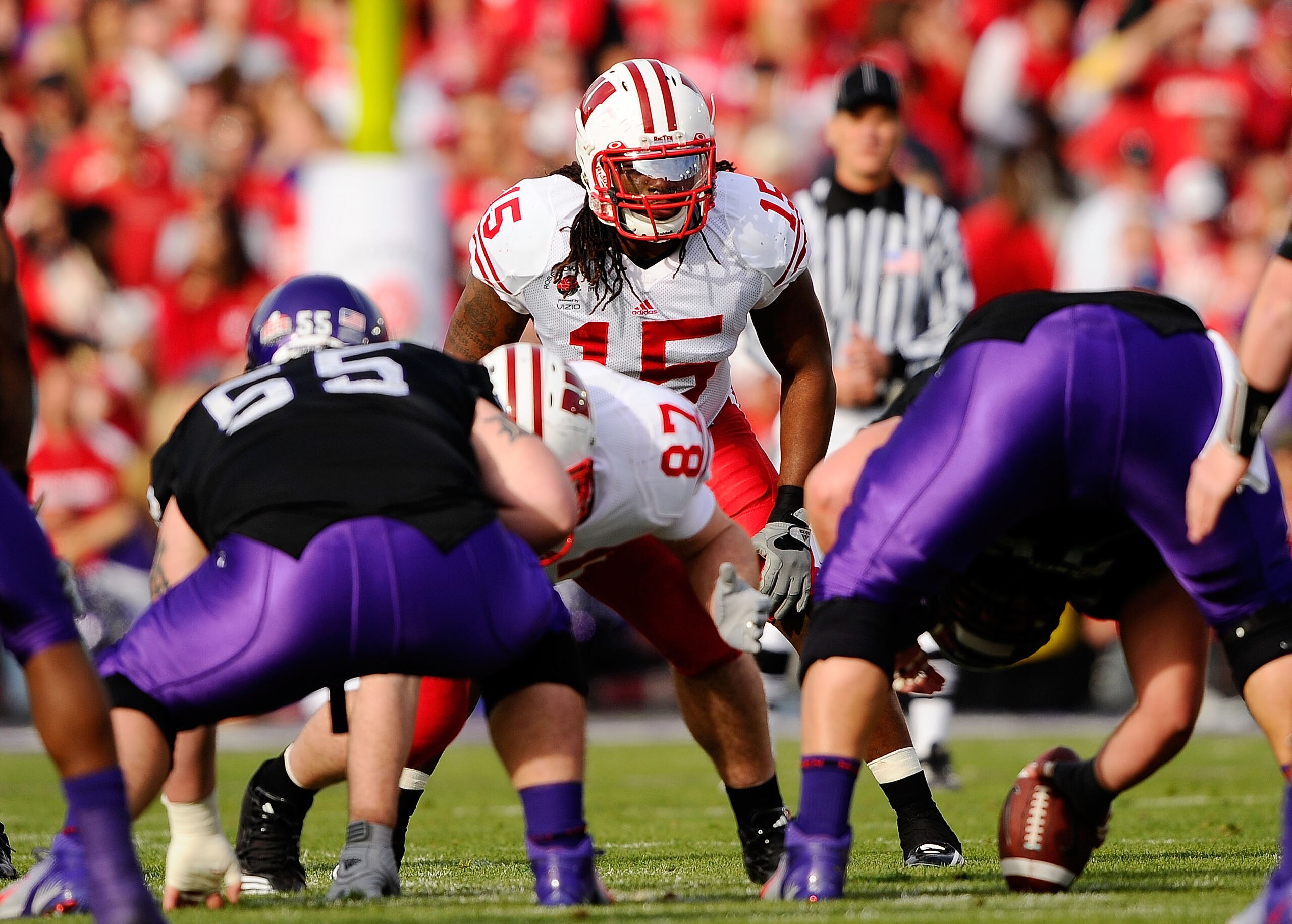 PASADENA, CA - JANUARY 01:  Linebacker Culmer St. Jean #15 of the Wisconsin Badgers lines up against the TCU Horned Frogs during the 97th Rose Bowl game on January 1, 2011 in Pasadena, California.  (Photo by Kevork Djansezian/Getty Images)