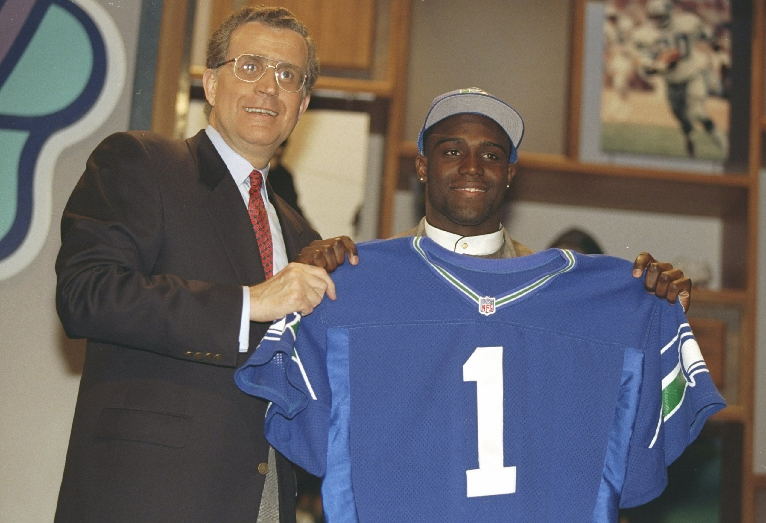 19 Apr 1997:  Cornerback Shawn Springs of the Ohio State Buckeyes holds a jersey of the Seattle Seahawks at the NFL Draft at Paramount Studios in Manhattan, New York.  Springs was the number three pick. Mandatory Credit: Al Bello  /Allsport