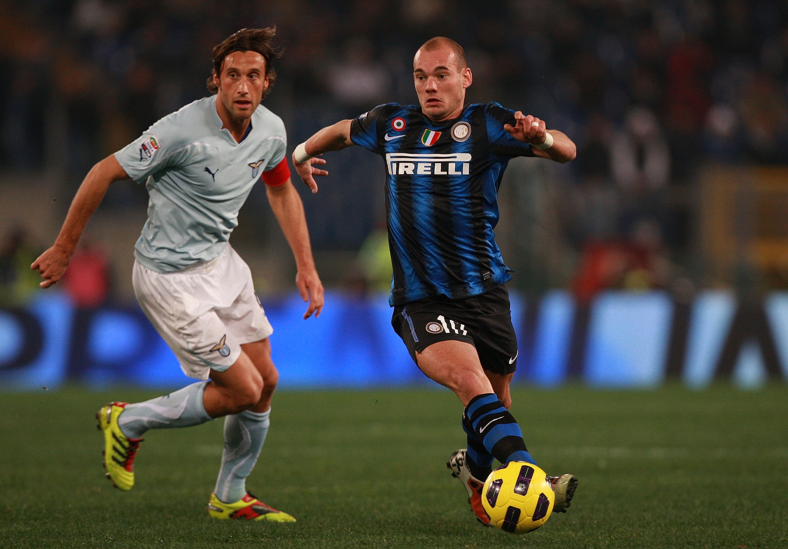 ROME, ITALY - DECEMBER 03:  Stefano Mauri (L) of SS Lazio competes for the ball with Wesley Sneijder of FC Internazionale Milano during the Serie A match between SS Lazio and FC Internazionale Milano at Stadio Olimpico on December 3, 2010 in Rome, Italy. 