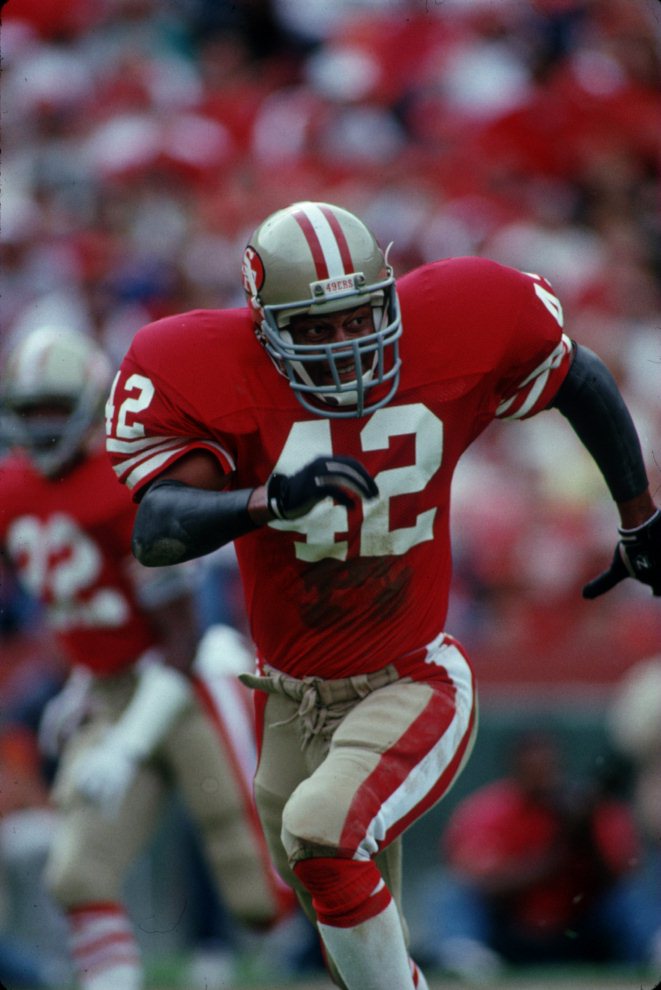 Strong safety Ronnie Lott of the San Francisco 49ers stands and