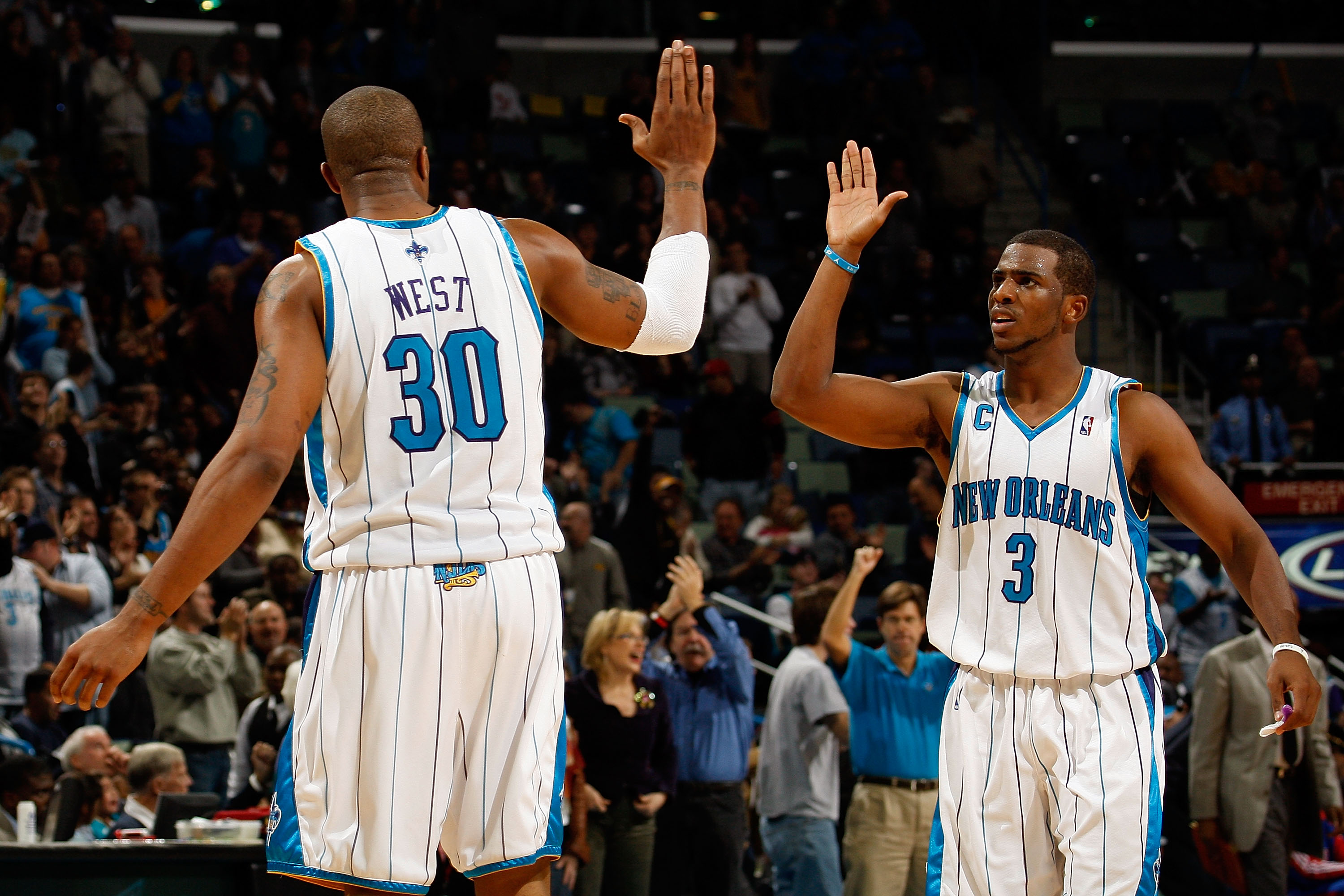 NEW ORLEANS - DECEMBER 16: Chris Paul #3 and David West #30 of the New Orleans Hornets celebrate during the game against the Detroit Pistons at New Orleans Arena on December 16, 2009 in New Orleans, Louisiana. The Hornets defeated the Pistons 95-87. NOTE NEW ORLEANS - DECEMBER 16: Chris Paul #3 and David West #30 of the New Orleans Hornets celebrate during the game against the Detroit Pistons at New Orleans Arena on December 16, 2009 in New Orleans, Louisiana. The Hornets defeated the Pistons 95-87. NOTE