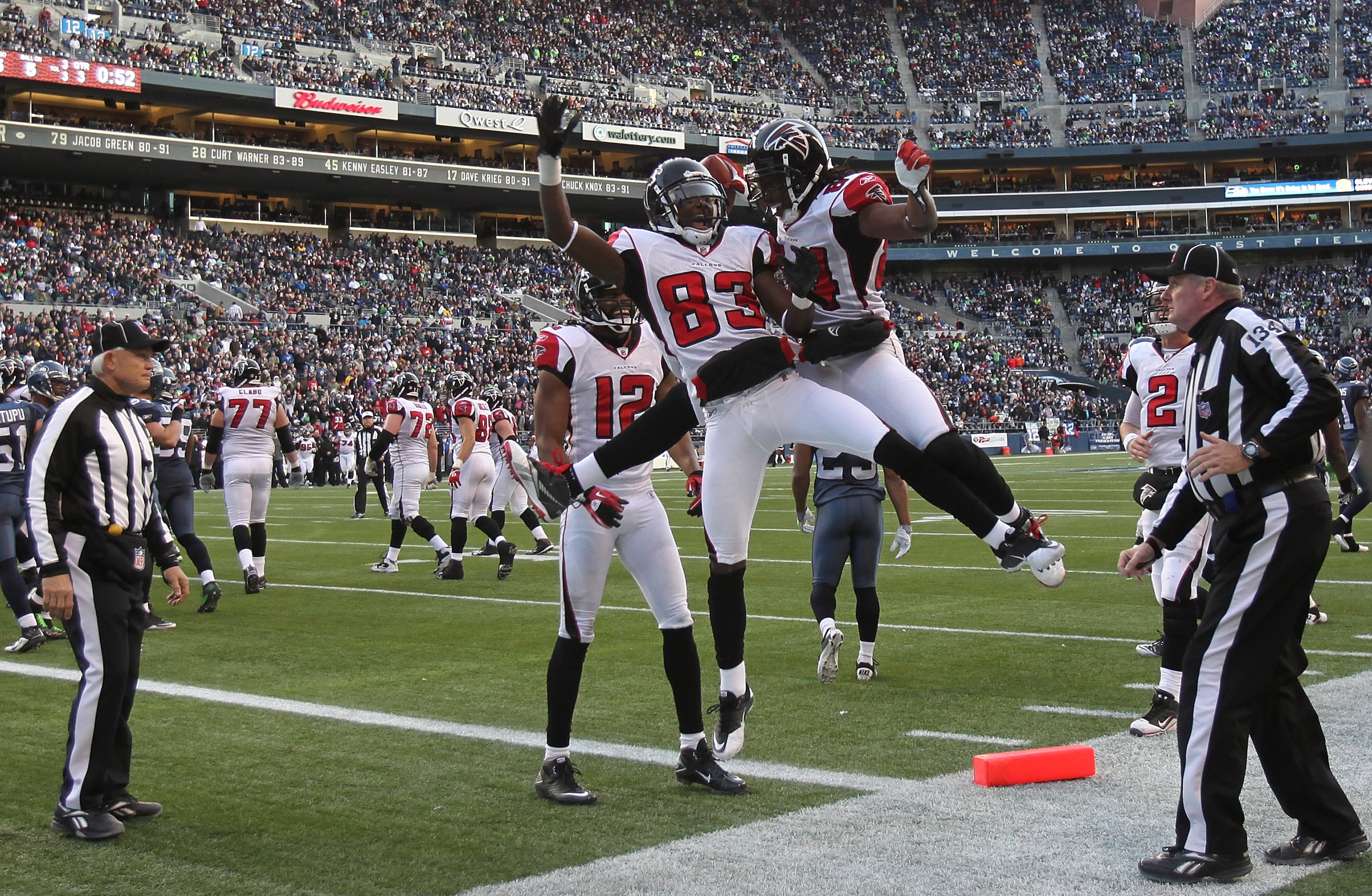 SEATTLE, WA - DECEMBER 19: Wide receiver Roddy White #84 of the Atlanta Falcons celebrates with Harry Douglas #83 and Michael Jenkins #12 after scoring a touchdown against the Seattle Seahawks at Qwest Field on December 19, 2010 in Seattle, Washington. T SEATTLE, WA - DECEMBER 19: Wide receiver Roddy White #84 of the Atlanta Falcons celebrates with Harry Douglas #83 and Michael Jenkins #12 after scoring a touchdown against the Seattle Seahawks at Qwest Field on December 19, 2010 in Seattle, Washington. T