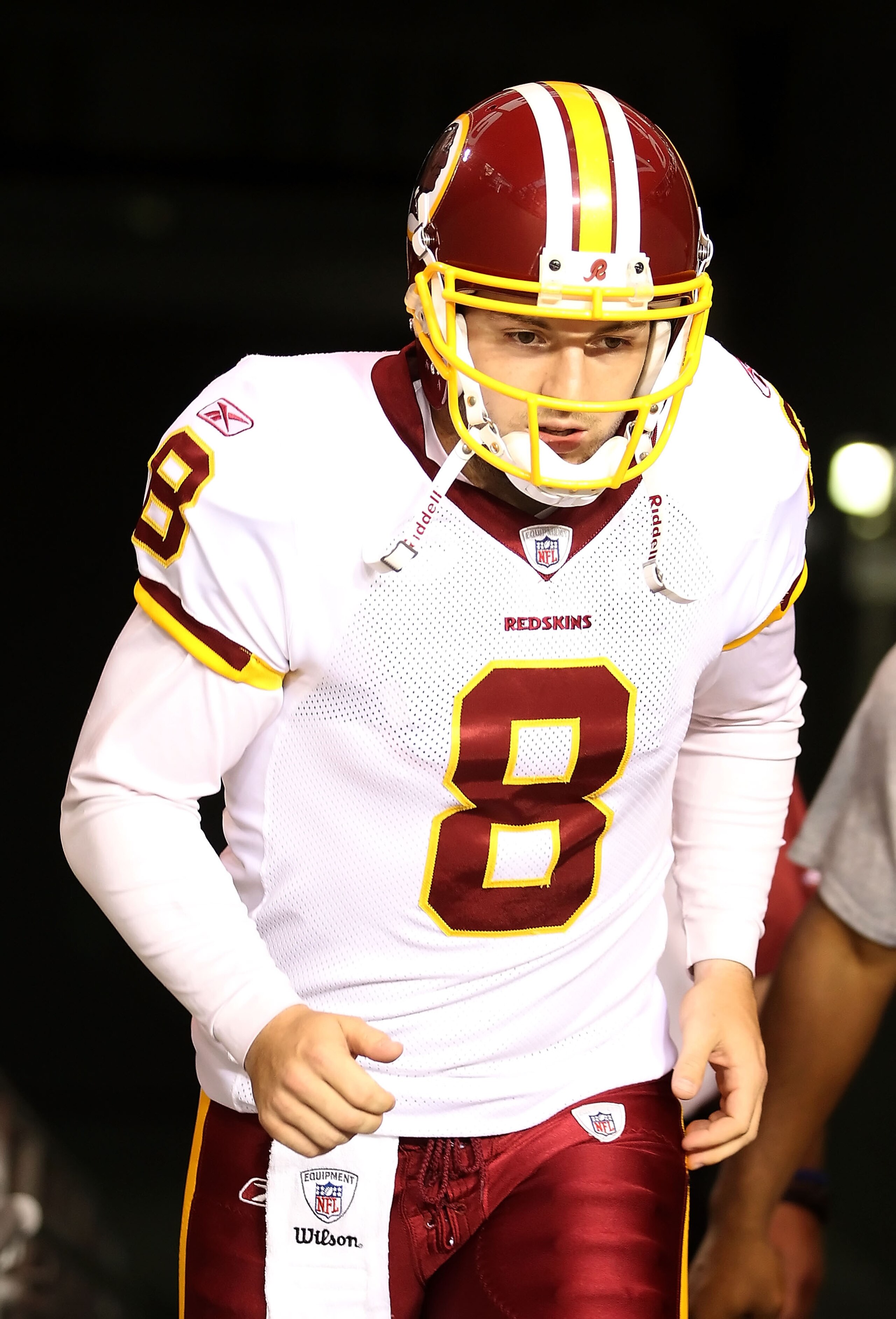 GLENDALE, AZ - SEPTEMBER 02:  Quarterback Rex Grossman #8 of the Washington Redskins runs out onto the field for warm ups to the preseason NFL game against the Arizona Cardinals at the University of Phoenix Stadium on September 2, 2010 in Glendale, Arizon