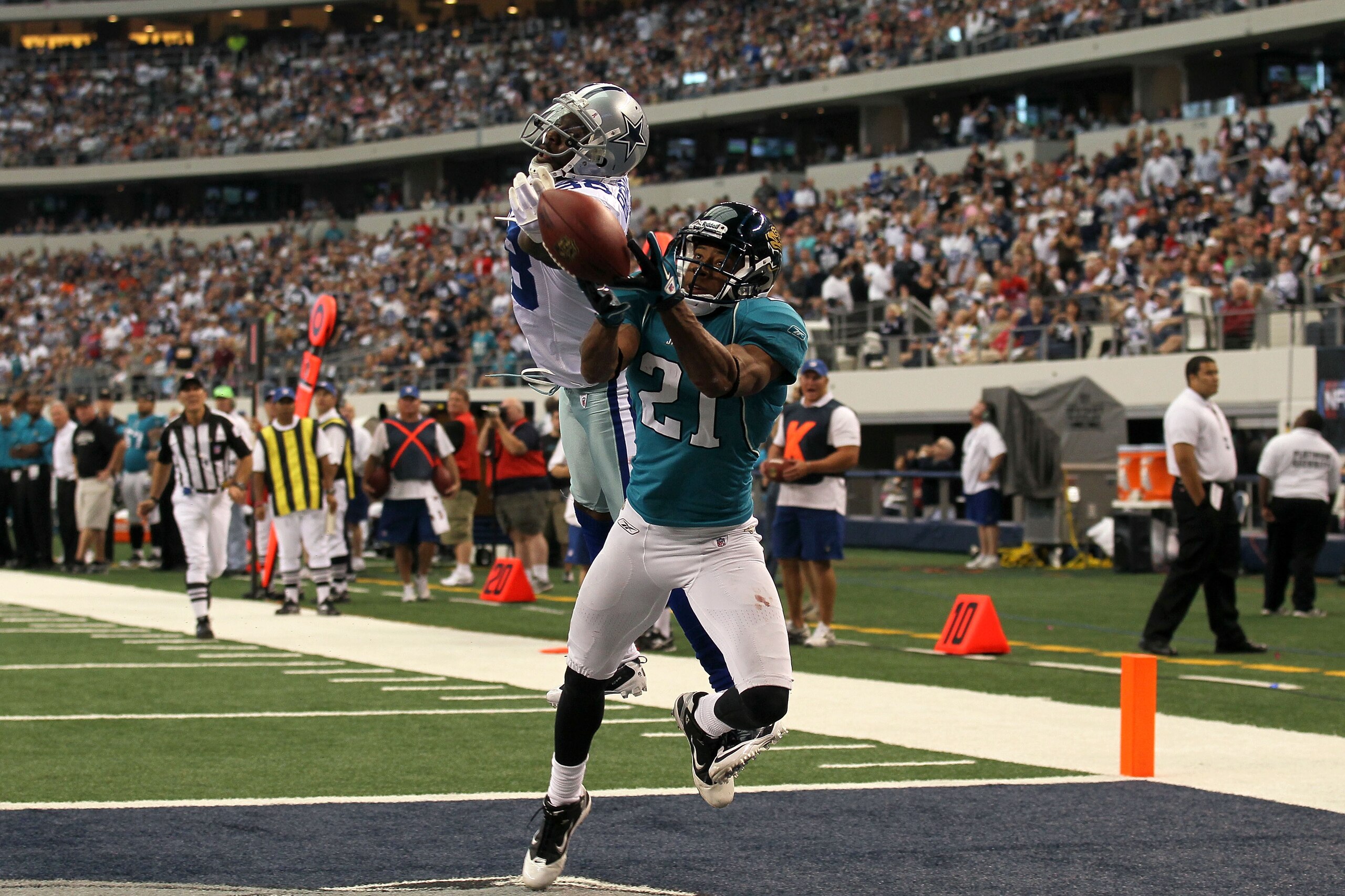 ARLINGTON, TX - OCTOBER 31:  Derek Cox #21 of the Jacksonville Jaguars breaks up a pass in the endzone intended for Dez Bryant #88 of the Dallas Cowboys at Cowboys Stadium on October 31, 2010 in Arlington, Texas.  (Photo by Stephen Dunn/Getty Images)