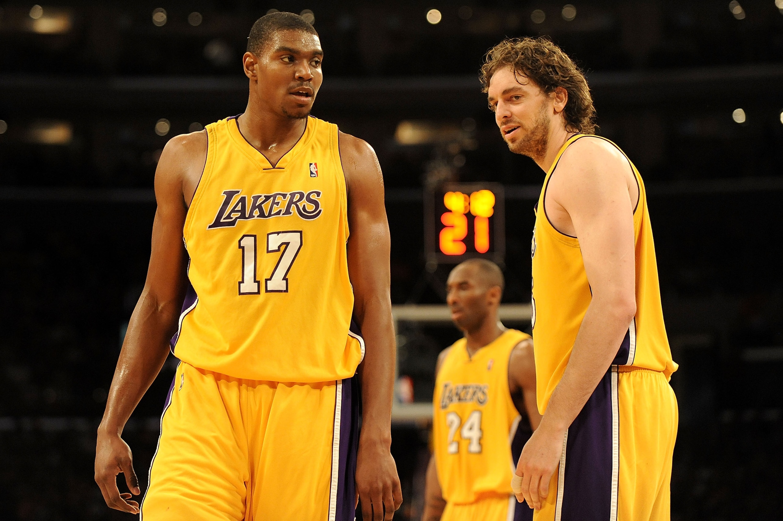 LOS ANGELES, CA - JANUARY 18:  (L-R) Andrew Bynum #17, Kobe Bryant #24 and Pau Gasol #16 of the Los Angeles Lakers stand on the court in the second quarter during the game against the Orlando Magic on January 18, 2010 at Staples Center in Los Angeles, Cal