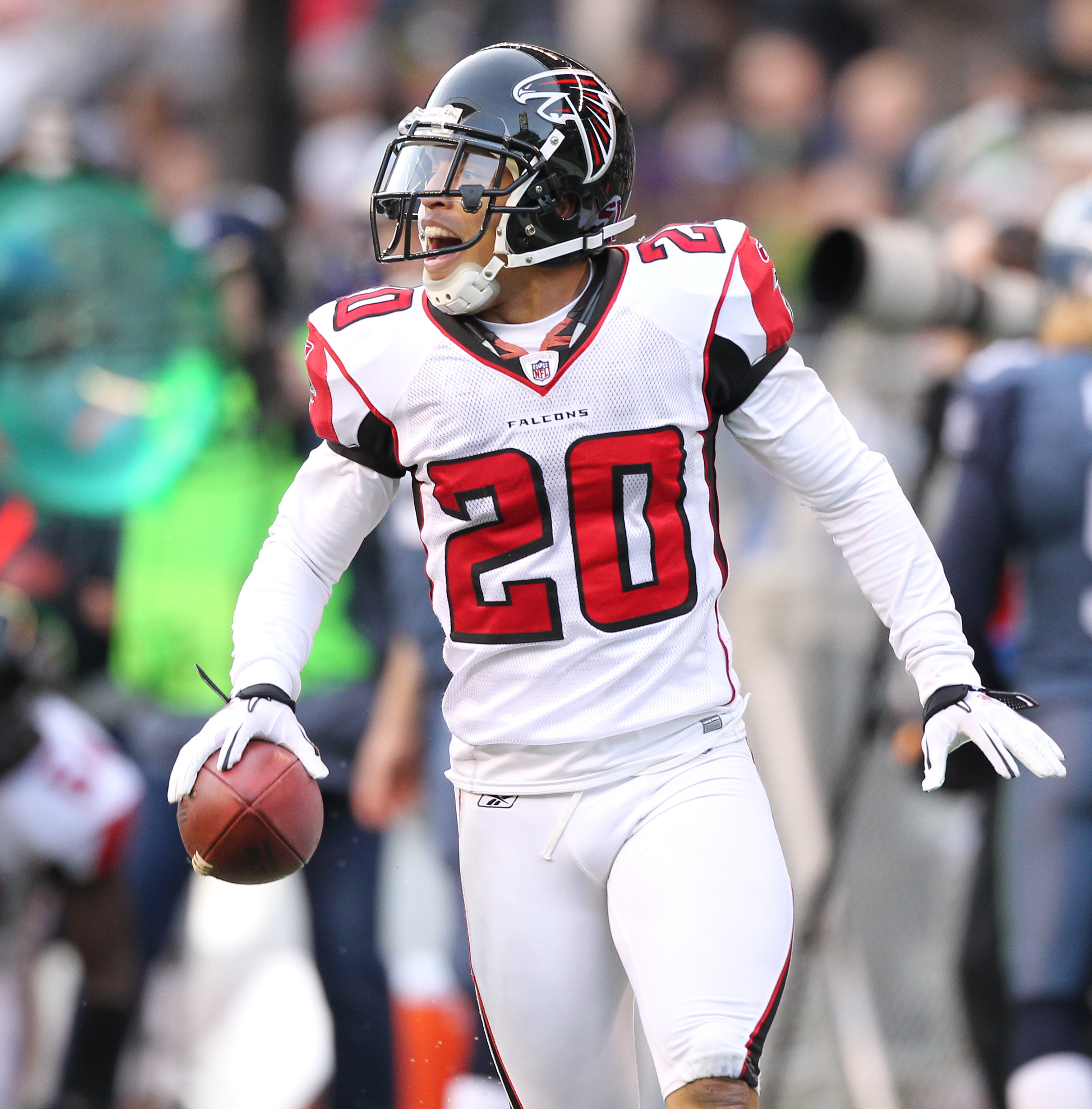 Falcons #20 Corner Back Brent Grimes up high for the ball in the