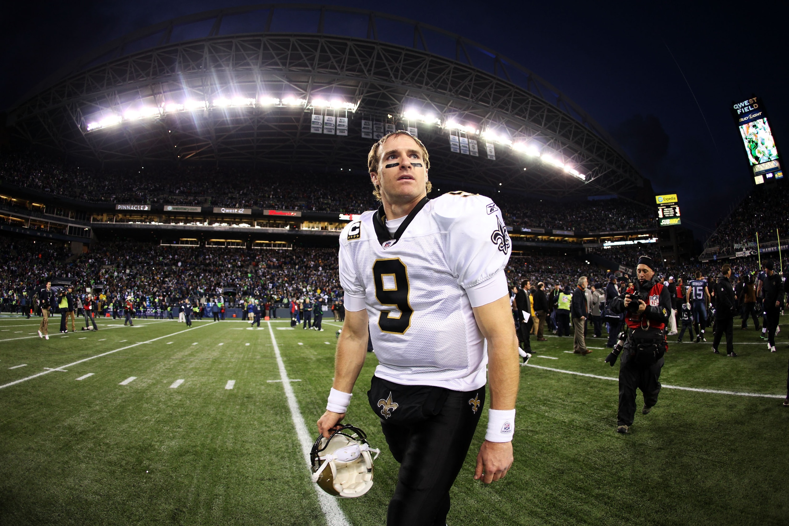 SEATTLE, WA - JANUARY 08:  Quarterback Drew Brees #9 of the New Orleans Saints walks off the field after the Saints were defeated 41-36 by the Seattle Seahawks during the 2011 NFC wild-card playoff game at Qwest Field on January 8, 2011 in Seattle, Washin