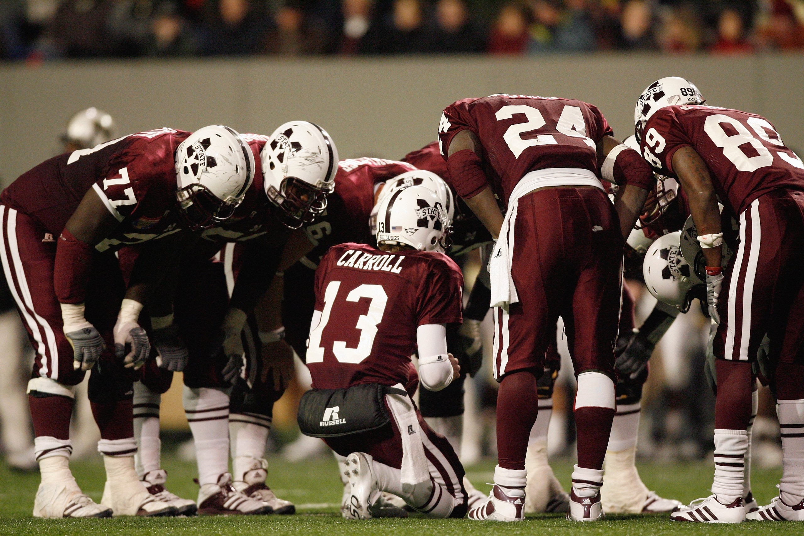 MEMPHIS, TN - DECEMBER 29: Wesley Carroll #13 of the Mississippi State Bulldogs calls a play in the huddle against the UCF Knights on December 29, 2007 at the Liberty Bowl Memorial Stadium in Memphis, Tennessee. The Bulldogs beat the Knights 10-3. (Photo