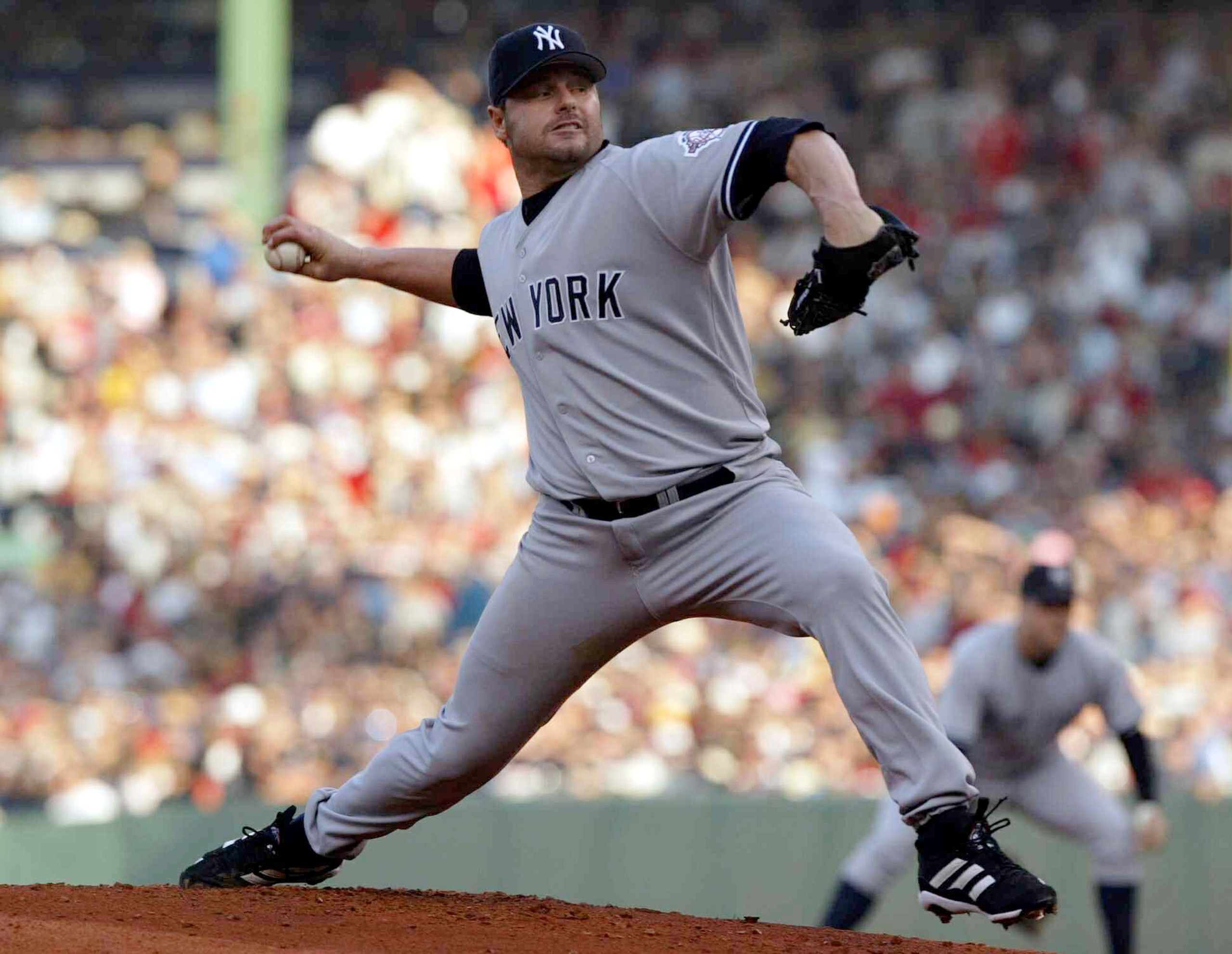 BOSTON - OCTOBER 11:  Roger Clemens #22 of the New York Yankees pitches against the Boston Red Sox during Game 3 of the 2003 American League Championship Series on October 11, 2003 at Fenway Park in Boston, Massachusettes.  (Photo by Doug Pensinger/Getty