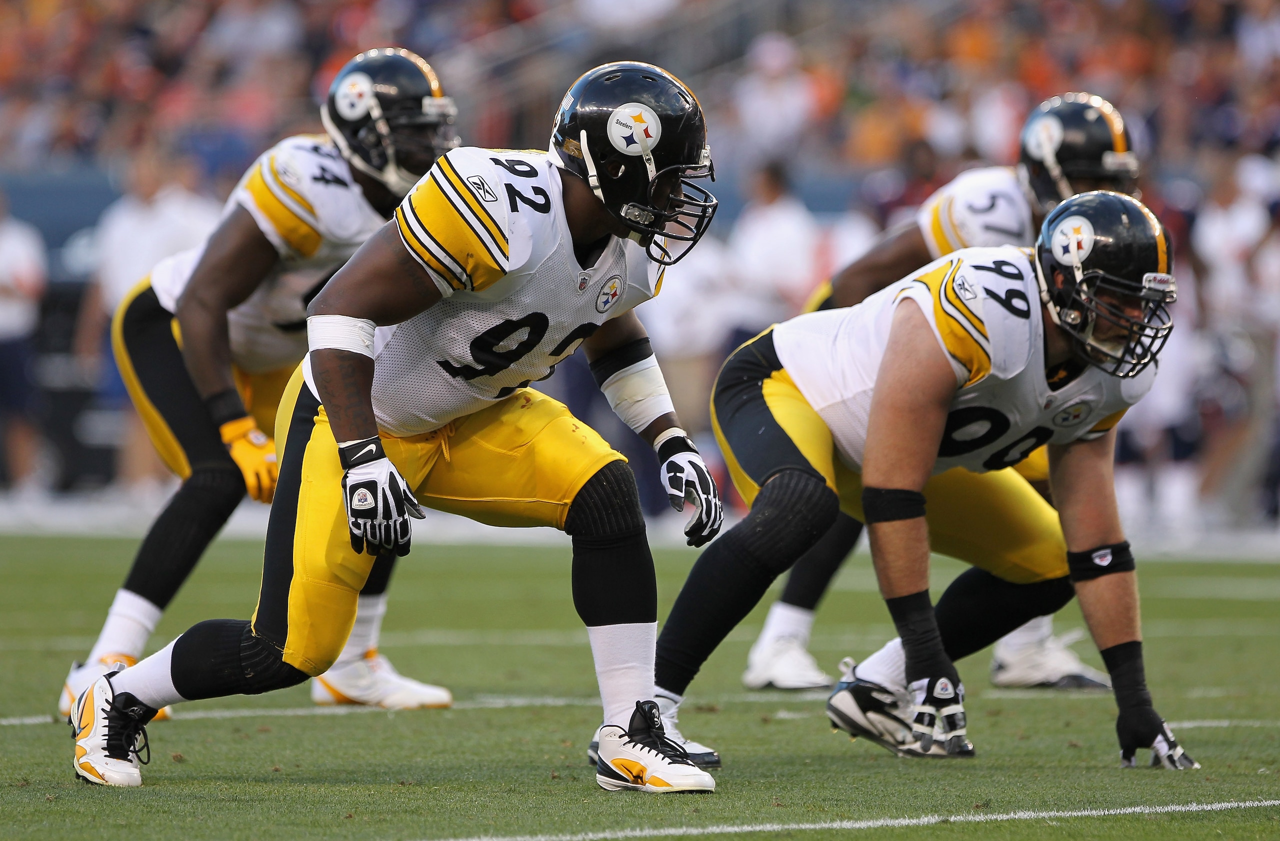 DENVER - AUGUST 29:  Linebacker James Harrison #92 and defensive end Brett Keisel #99 of the Pittsburgh Steelers lead the defense against the Denver Broncos during preseason NFL action at INVESCO Field at Mile High on August 29, 2010 in Denver, Colorado.