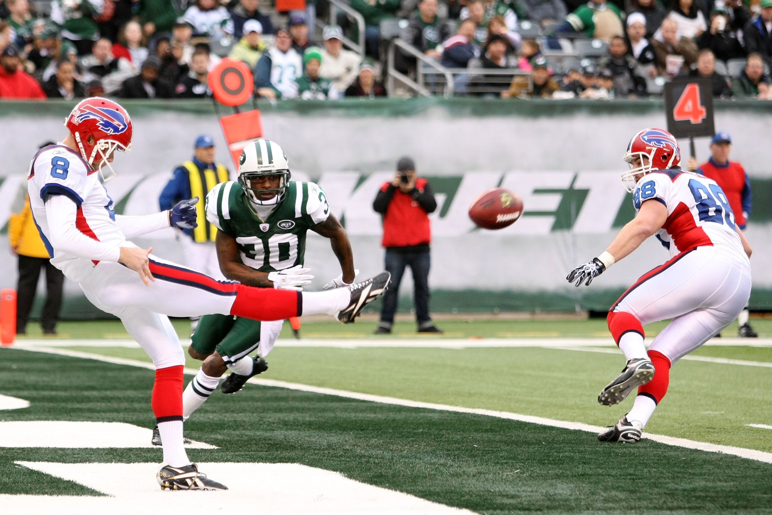 EAST RUTHERFORD, NJ - JANUARY 02:  Brian Moorman #8 of the Buffalo Bills kicks the ball against the New York Jets at New Meadowlands Stadium on January 2, 2011 in East Rutherford, New Jersey.  (Photo by Michael Heiman/Getty Images)