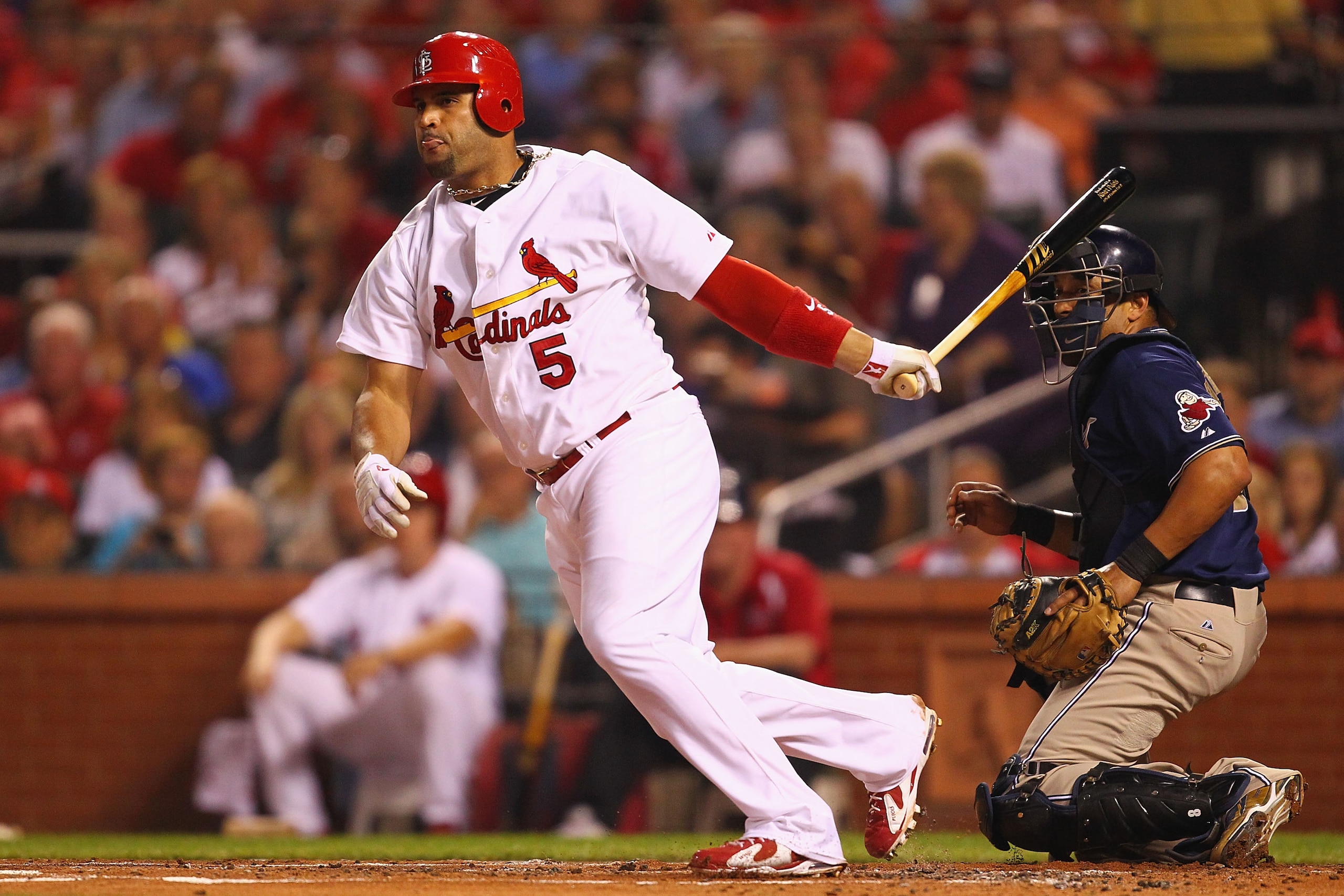 ST. LOUIS - SEPTEMBER 17: Albert Pujols #5 of the St. Louis Cardinals hits an RBI double against the San Diego Padres at Busch Stadium on September 17, 2010 in St. Louis, Missouri.  (Photo by Dilip Vishwanat/Getty Images)