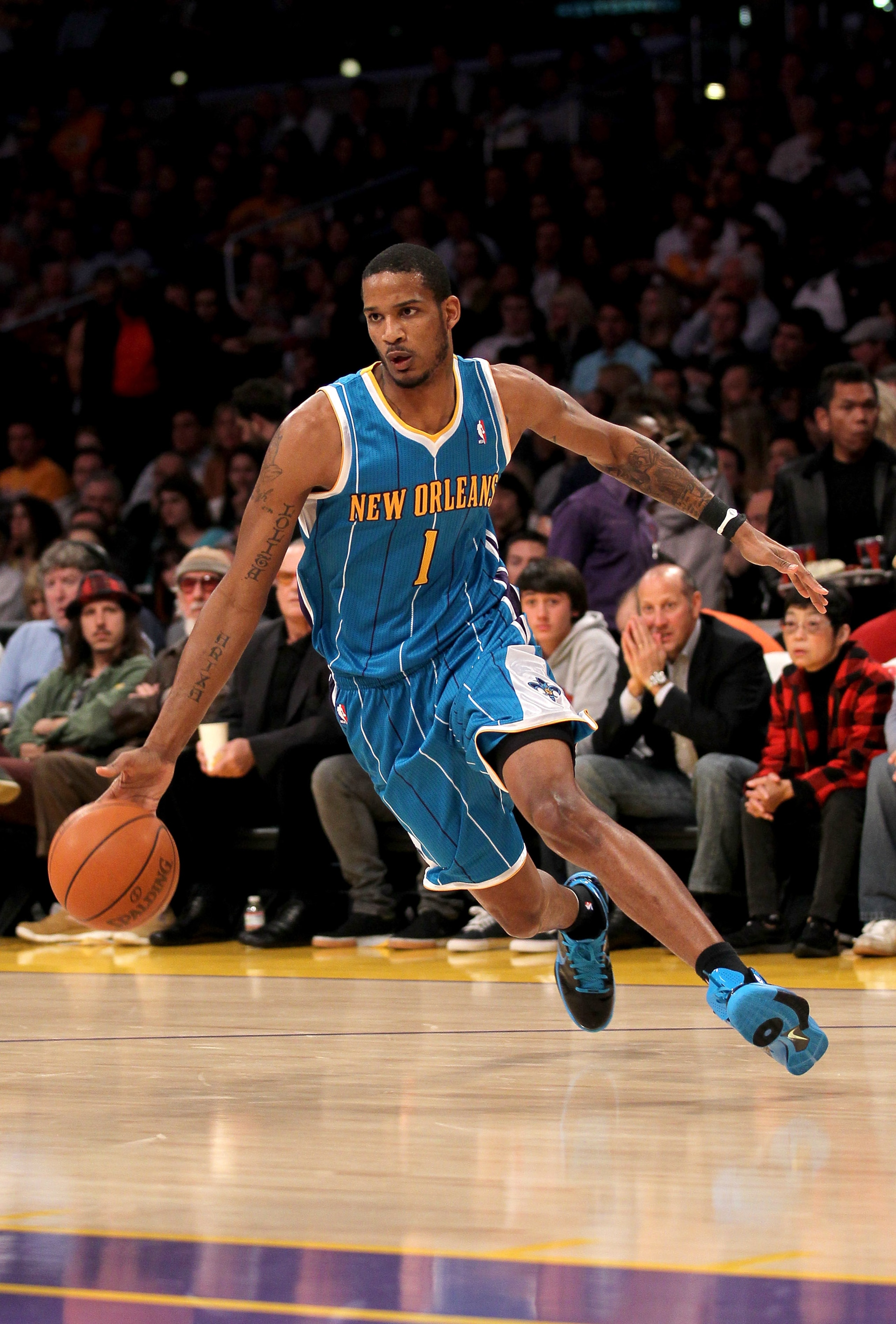 LOS ANGELES, CA - JANUARY 07: Trevor Ariza #1 of the New Orleans Hornets drives against the Los Angeles Lakers at Staples Center on January 7, 2011 in Los Angeles, California. The Lakers won 101-97. NOTE TO USER: User expressly acknowledges and agrees LOS ANGELES, CA - JANUARY 07: Trevor Ariza #1 of the New Orleans Hornets drives against the Los Angeles Lakers at Staples Center on January 7, 2011 in Los Angeles, California. The Lakers won 101-97. NOTE TO USER: User expressly acknowledges and agrees