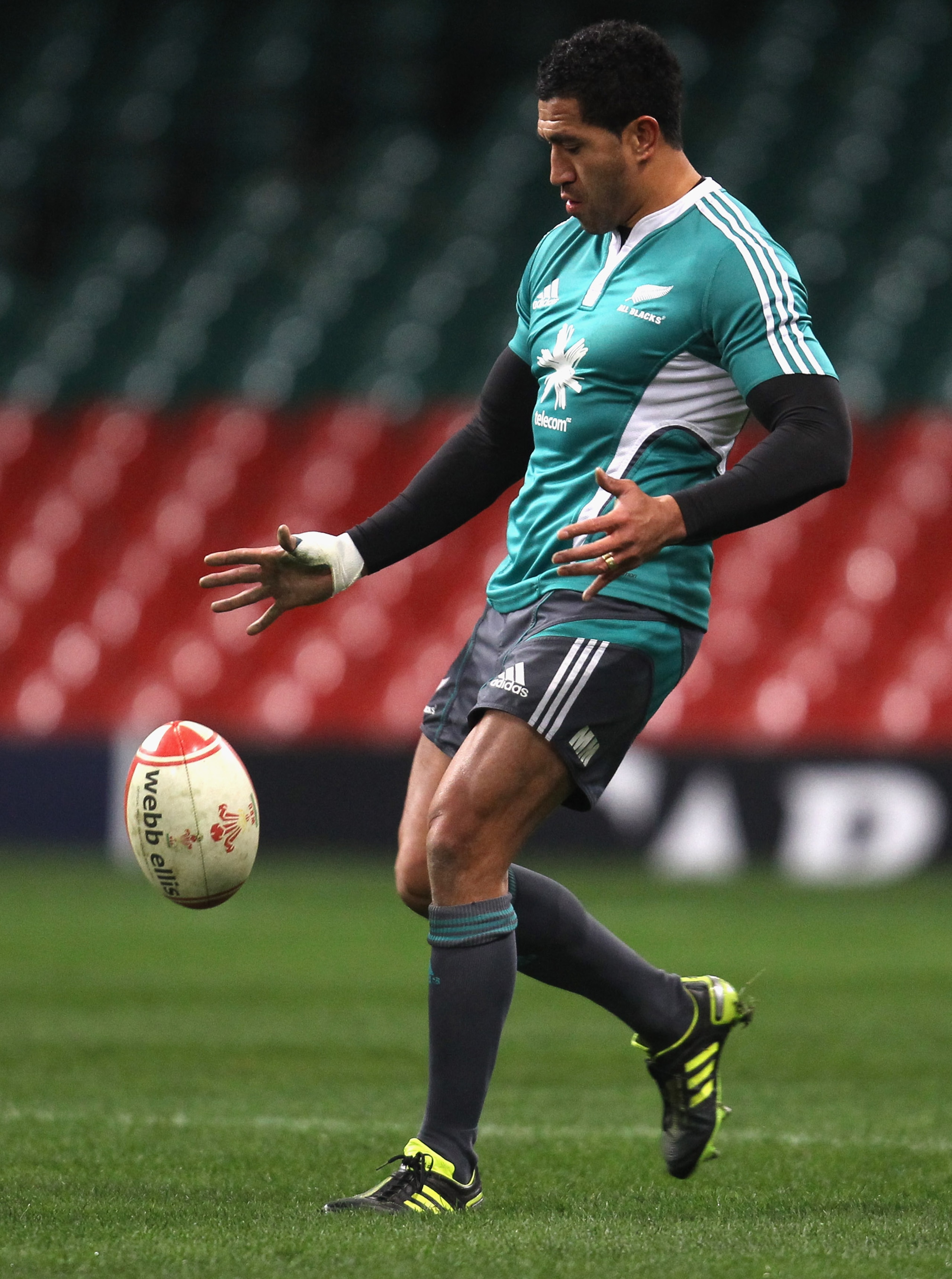 CARDIFF, WALES - NOVEMBER 26: Mils Muliaina of the All Blacks practices a kick during the New Zealand All Blacks Captains Run at Millennium Stadium on November 26, 2010 in Cardiff, Wales.  (Photo by Phil Walter/Getty Images)