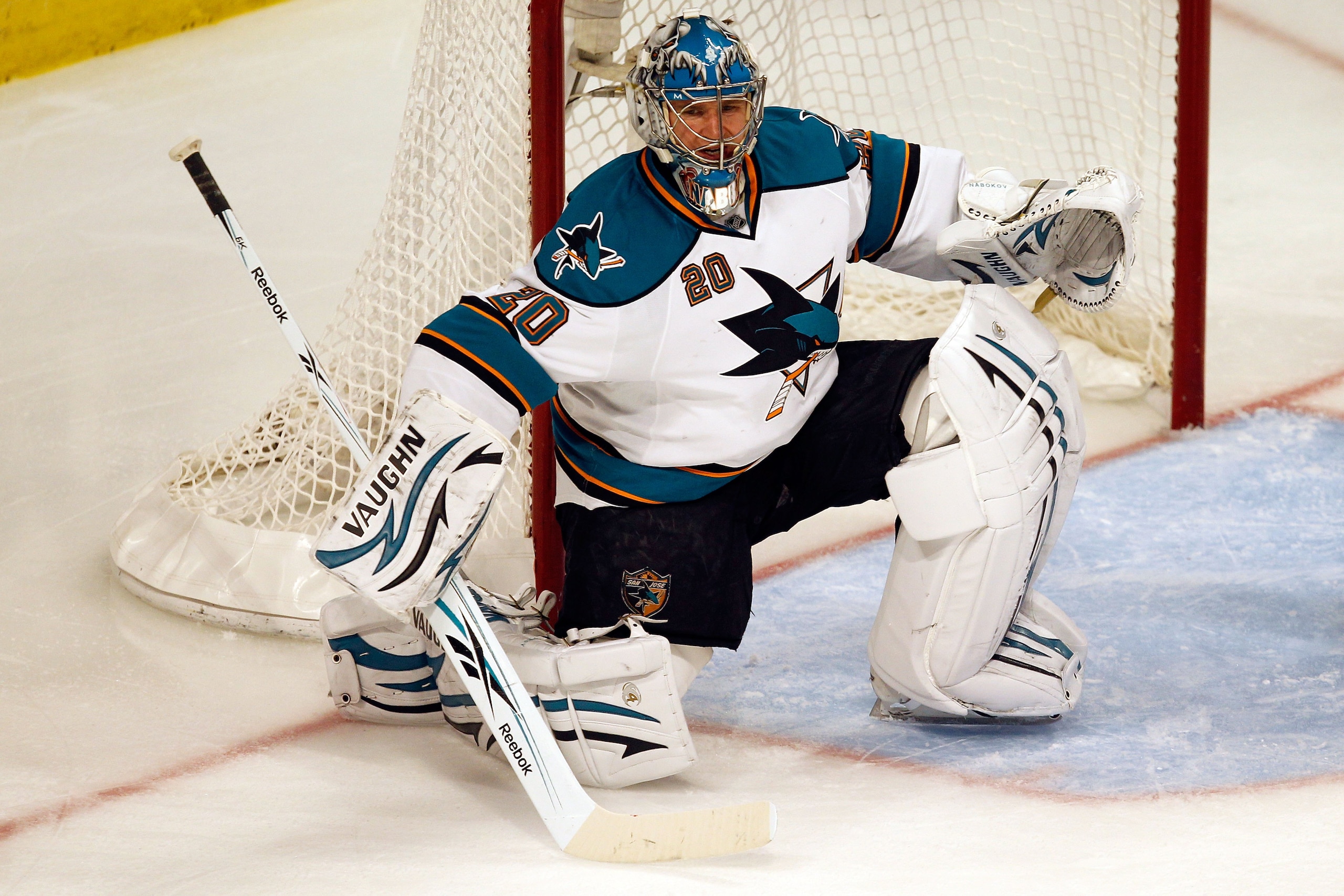 CHICAGO - MAY 23:  Goaltender Evgeni Nabokov #20 of the San Jose Sharks looks on while taking on the Chicago Blackhawks in Game Four of the Western Conference Finals during the 2010 NHL Stanley Cup Playoffs at the United Center on May 23, 2010 in Chicago,