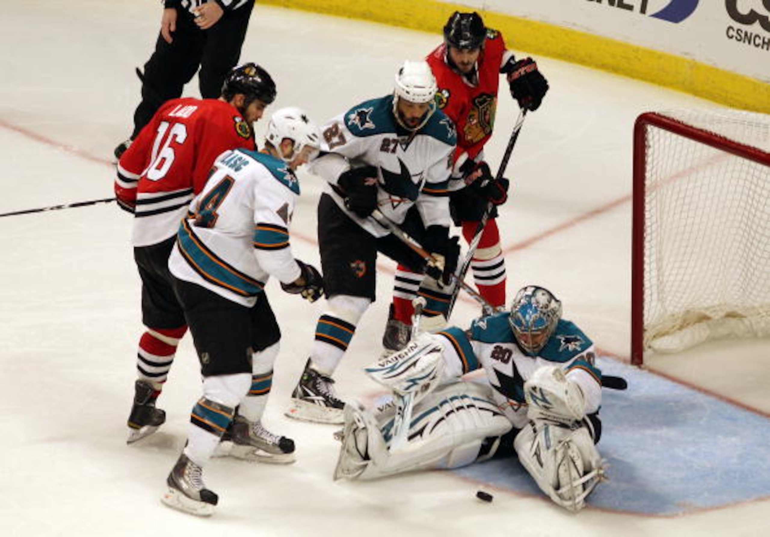 CHICAGO - MAY 21:  Goaltender Evgeni Nabokov #20 of the San Jose Sharks makes a save in overtime while taking on the Chicago Blackhawks in Game Three of the Western Conference Finals during the 2010 NHL Stanley Cup Playoffs at the United Center on May 21,