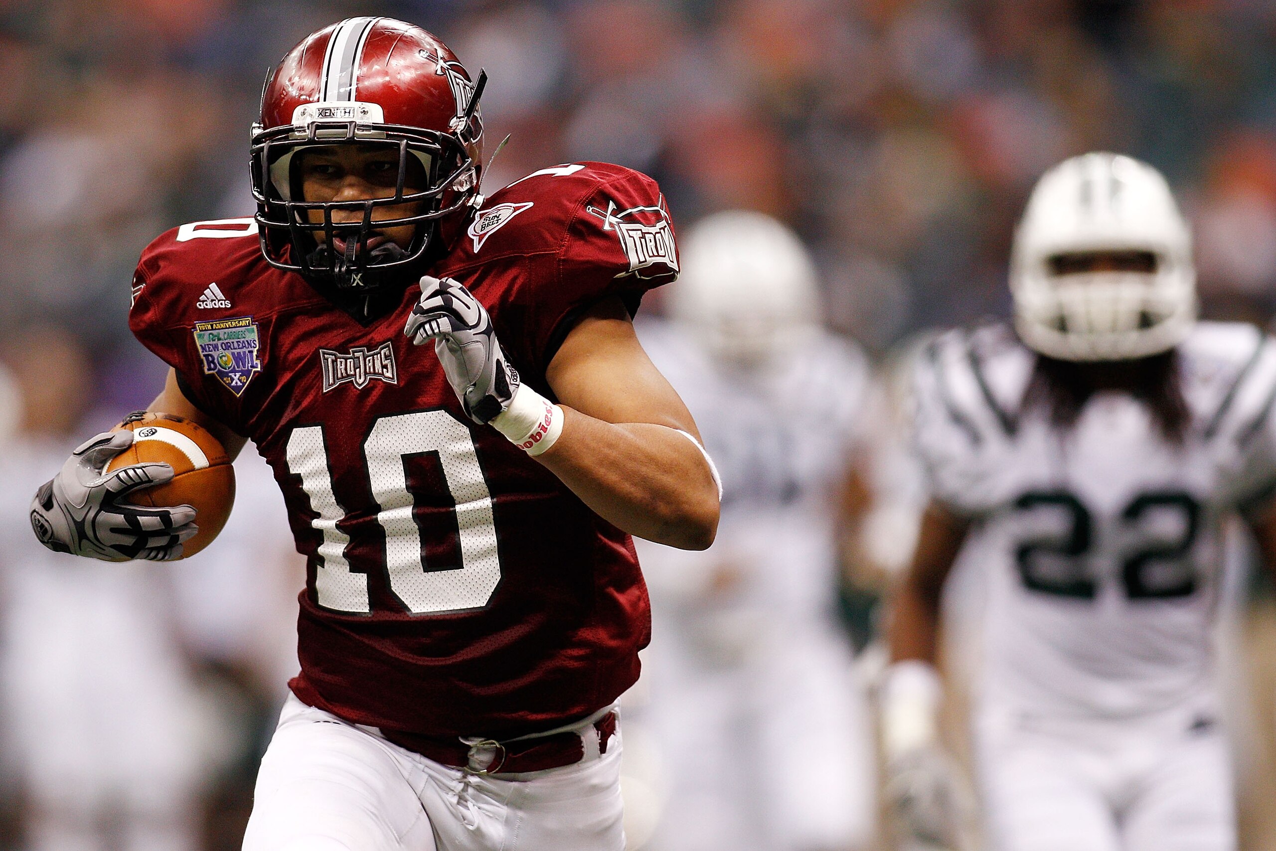 NEW ORLEANS, LA - DECEMBER 18:  Gill Tebiarus #10 of the Troy University Trojans scores a touchdown during the game against the Ohio University Bobcats during the R&L Carriers New Orleans Bowl at the Louisiana Superdome on December 18, 2010 in New Orleans
