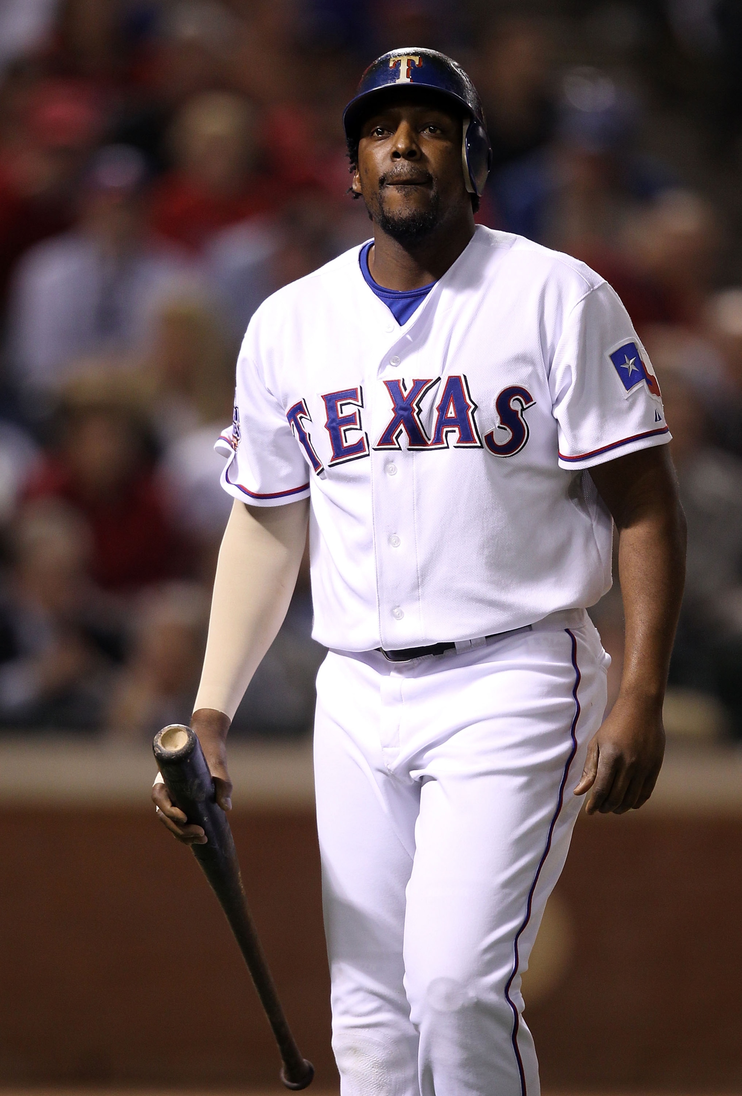ARLINGTON, TX - OCTOBER 31:  Vladimir Guerrero #27 of the Texas Rangers reacts as he walks back to the dugout after he struck out in the fourth inning against the San Francisco Giants in Game Four of the 2010 MLB World Series at Rangers Ballpark in Arling