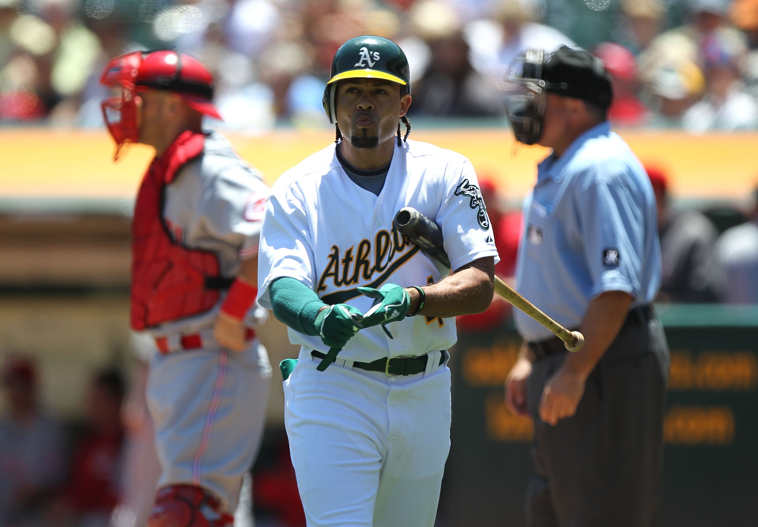 OAKLAND, CA - JUNE 23:  Coco Crisp #4 of the Oakland Athletics strikes out against the Cincinnati Reds in the first inning during an MLB game at the Oakland-Alameda County Coliseum on June 23, 2010 in Oakland, California.  (Photo by Jed Jacobsohn/Getty Im