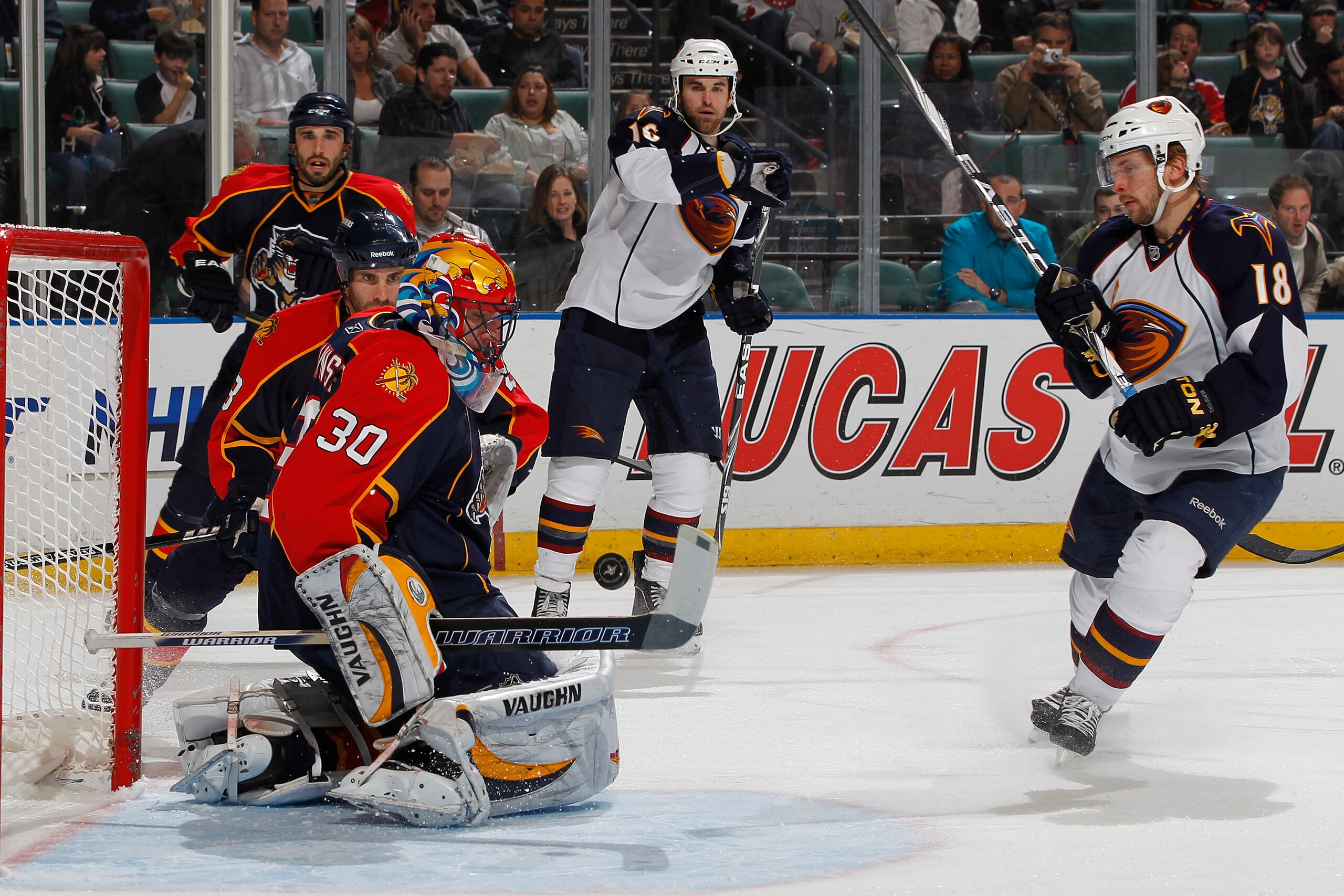 SUNRISE, FL - JANUARY 17: Goaltender Scott Clemmensen #30 of the Florida Panthers stops a shot from Niclas Bergfors #18 of the Atlanta Thrashers on January 17, 2011 at the BankAtlantic Center in Sunrise, Florida. (Photo by Joel Auerbach/Getty Images)